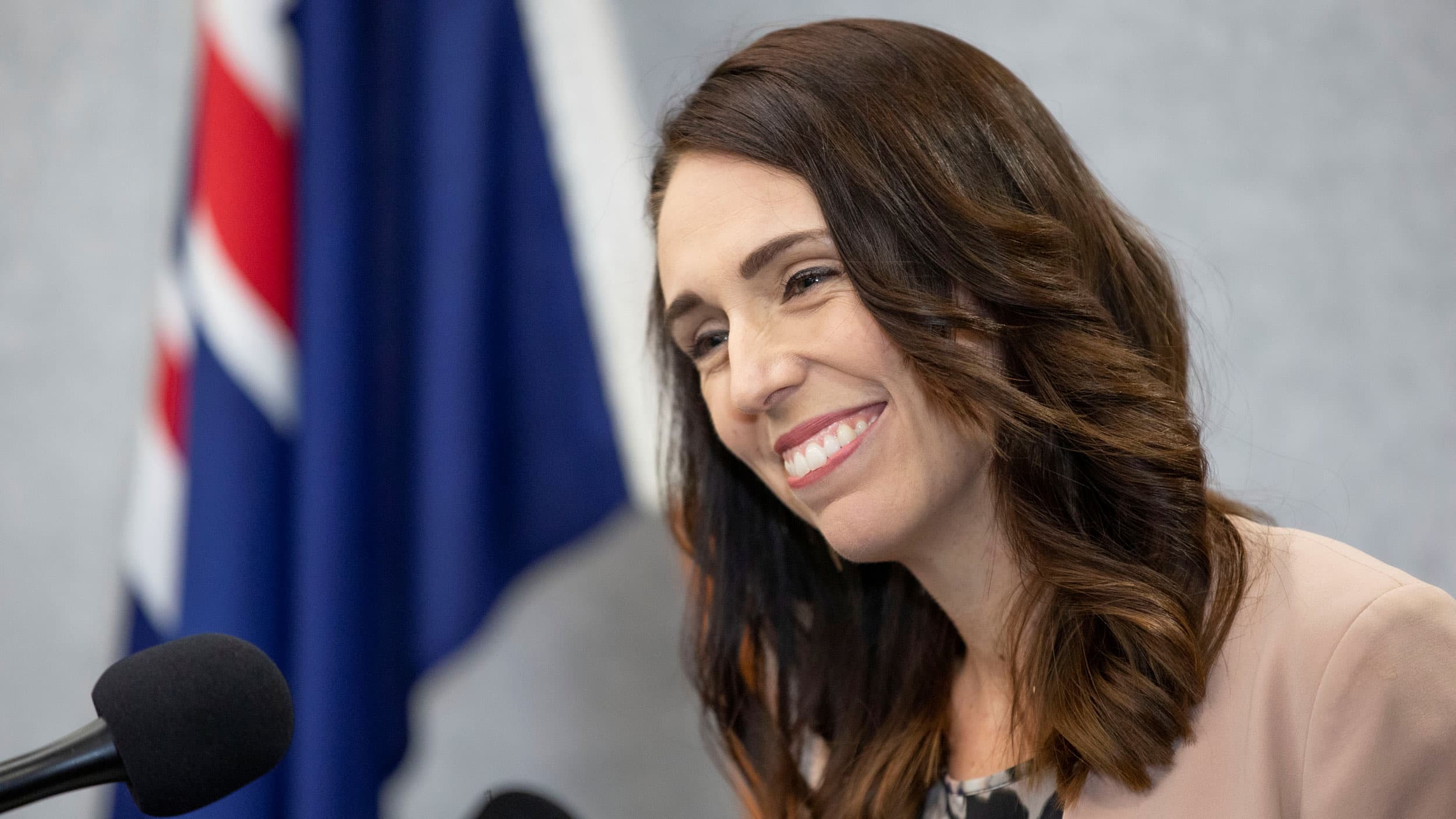 A midshot of a woman speaking at a podium