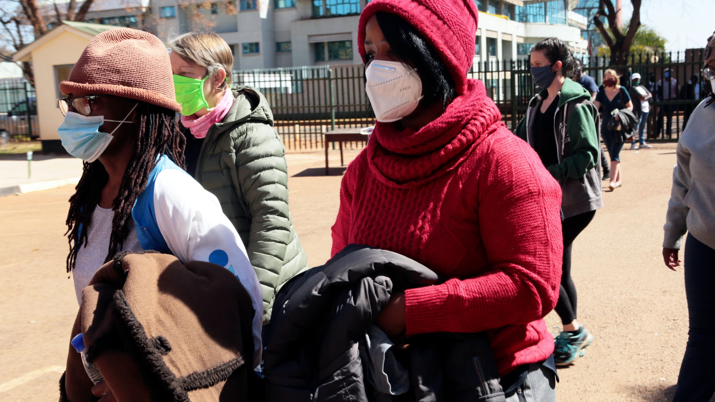 Tsitsi Dangerembga, left, prominent Zimbabwean author and Fadzayi Mahere, right, spokeswoman for the main opposition party, appear at the magistrates courts with others in Harare, Zimbabwe, August 1, 2020.
