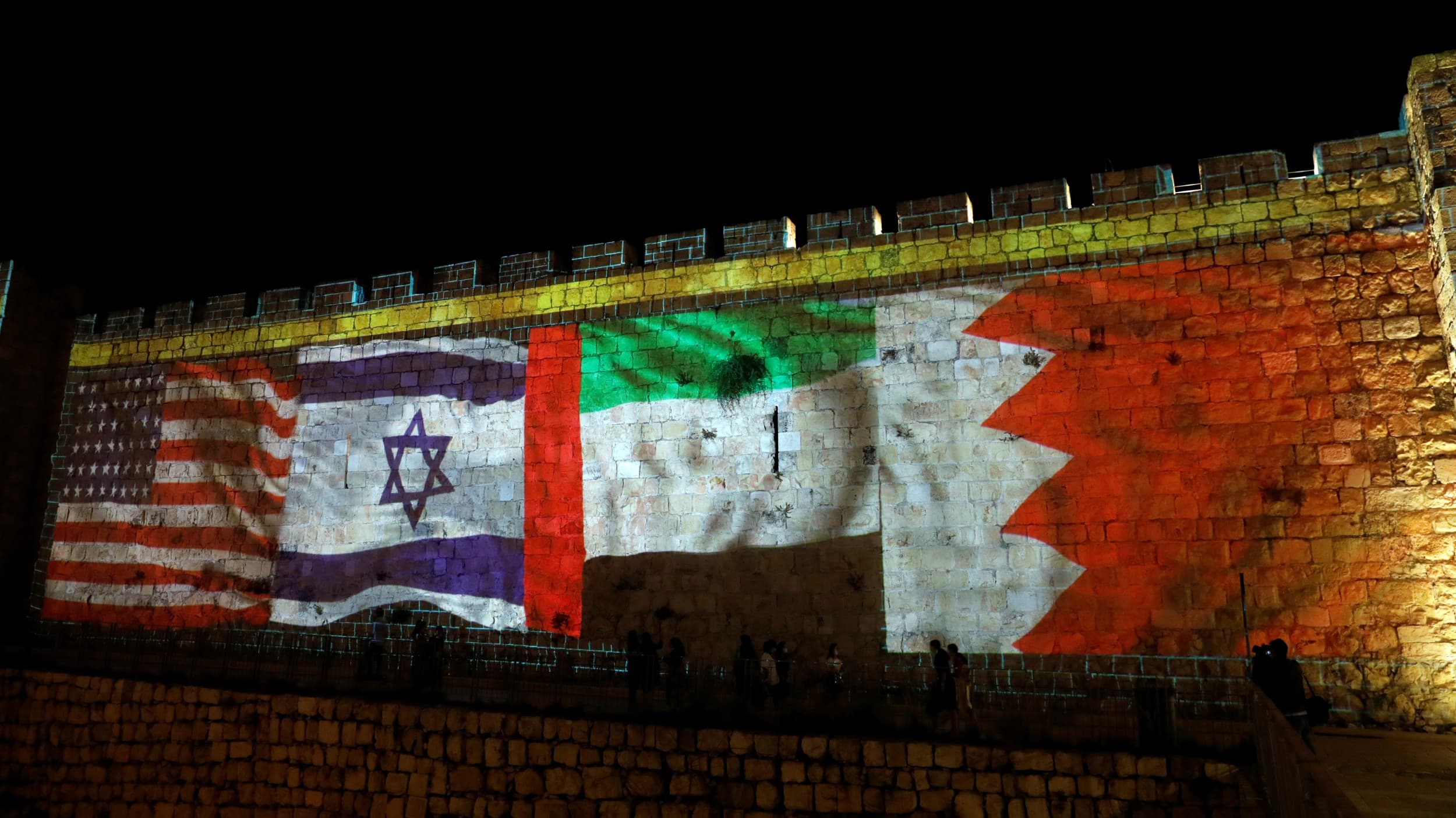 National flags of Bahrain, UAE, Israel and the US are projected onto the walls of Jerusalem's Old city, Sept. 15, 2020.