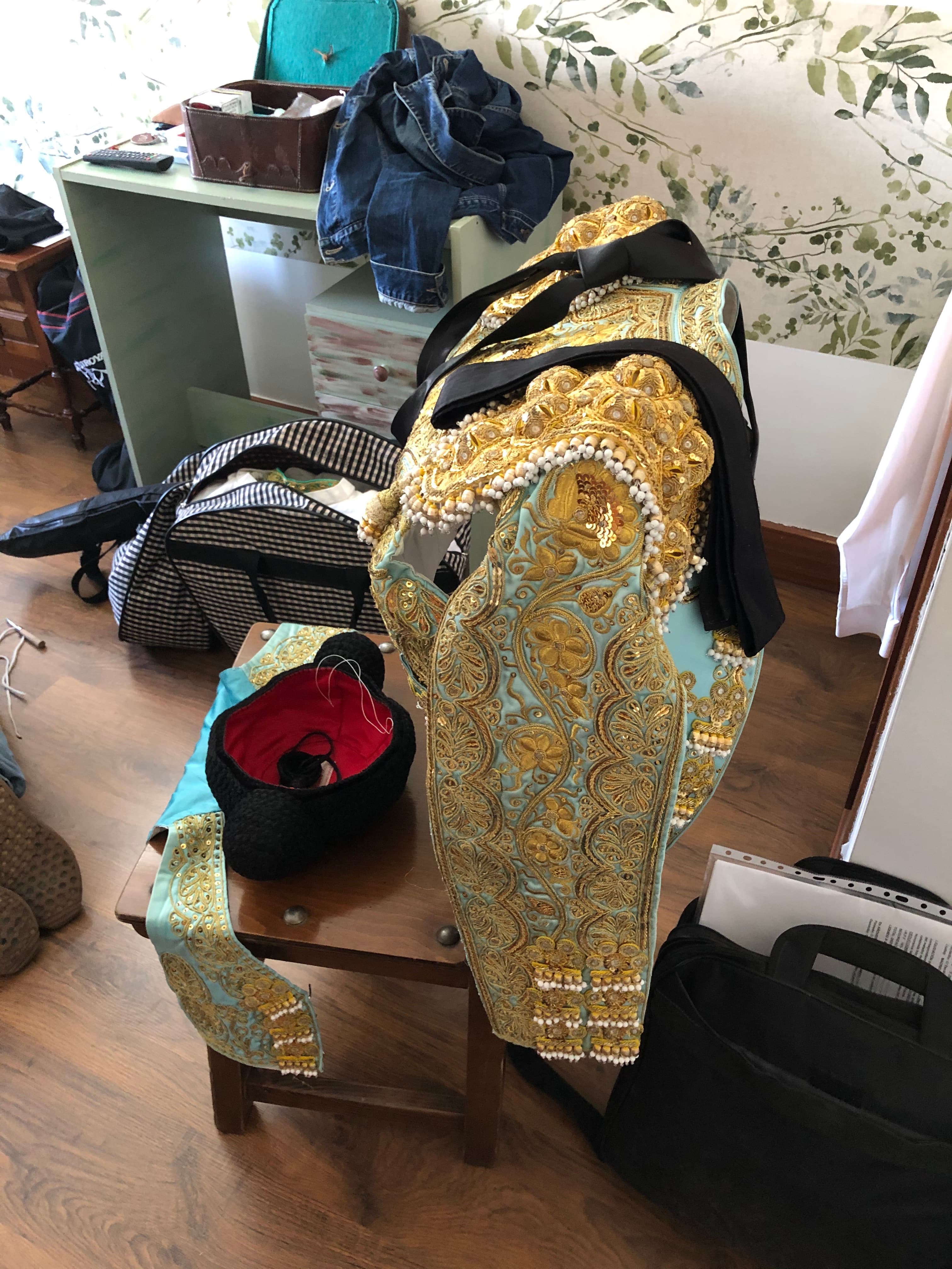 Leandro Gutierrez’s ornate bullfighting outfit draped on a chair.