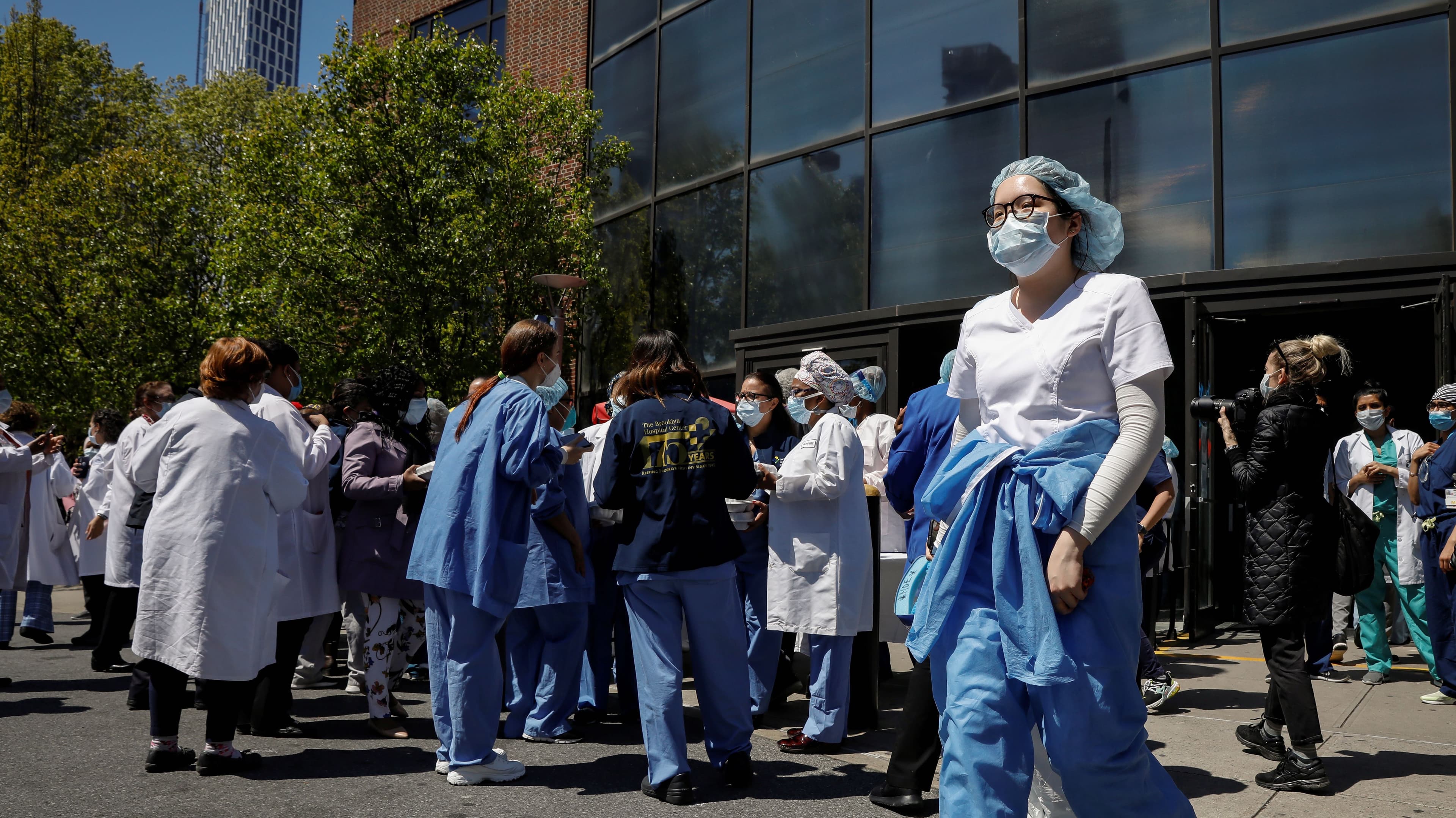Health care workers gather for lunch purchased by members of the New York City Police Department (NYPD)
