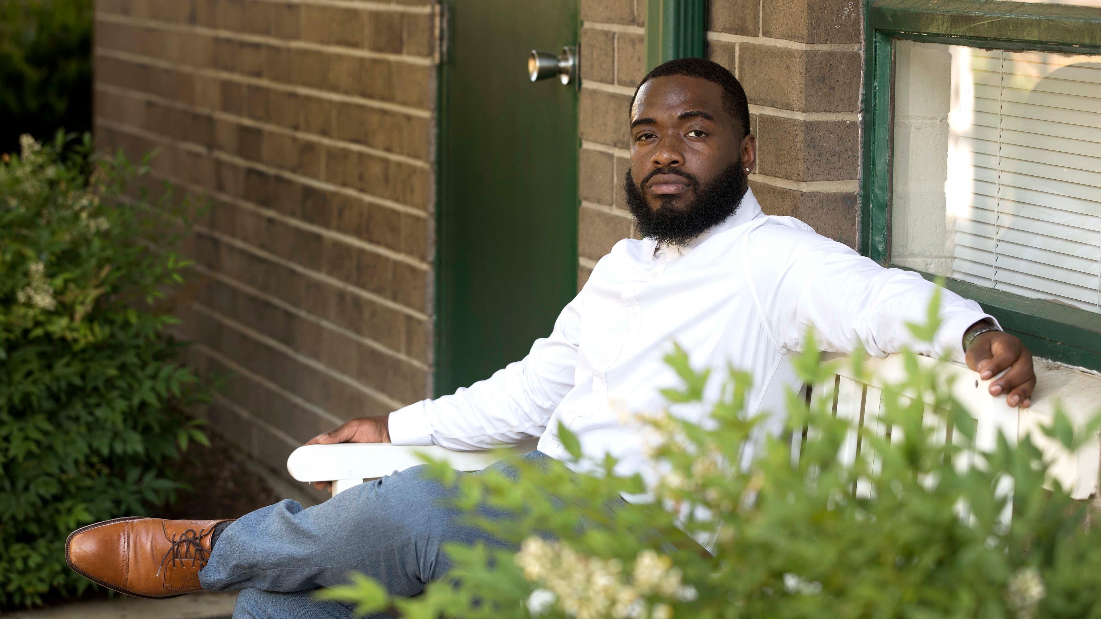 Brayan Guevara in front of Irving Park Elementary School, in Greensboro, North Carolina, where he is a teacher's assistant, June 3, 2020.