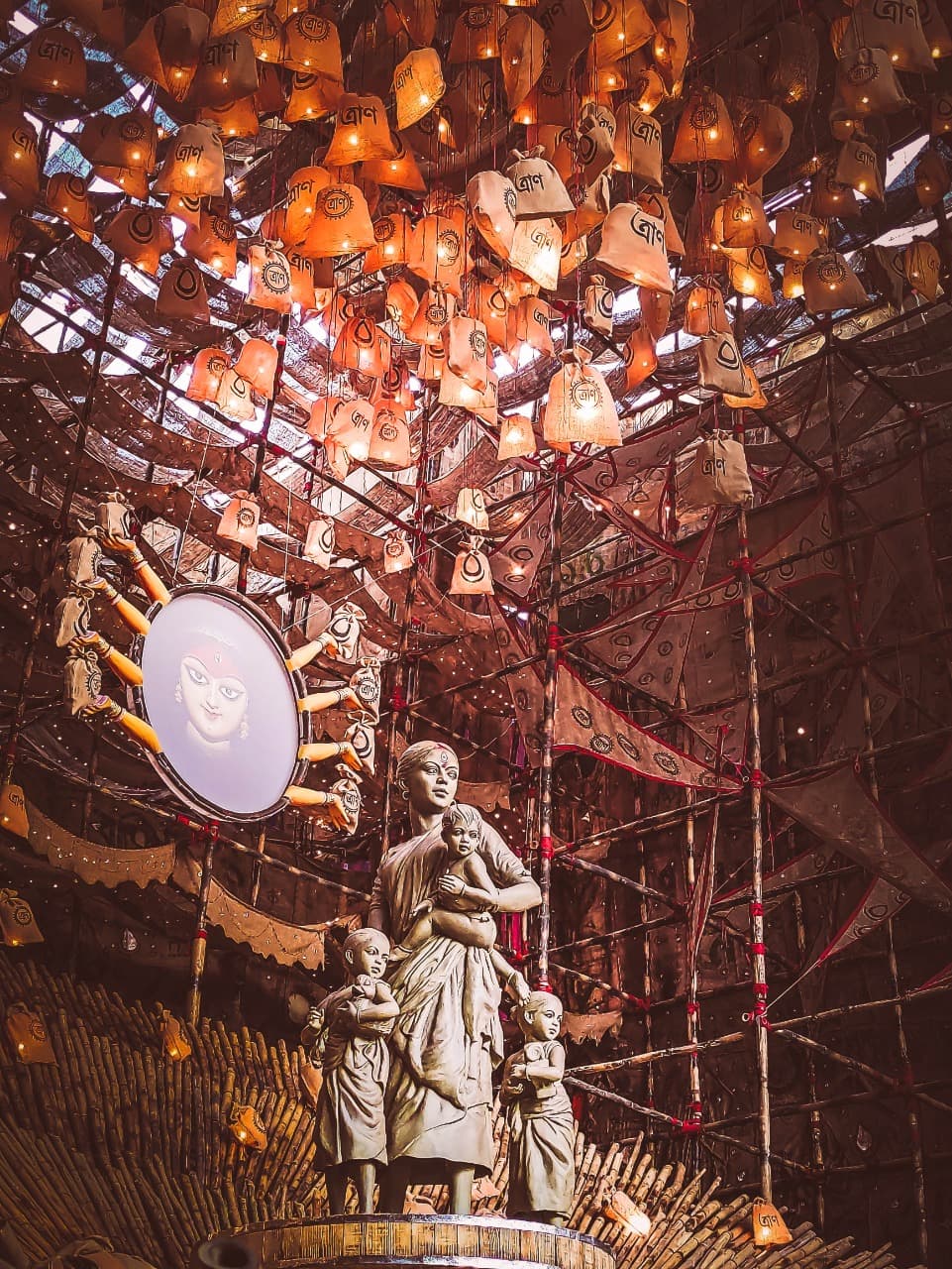A statue of a migrant woman made of simple clay as Durga goddess.