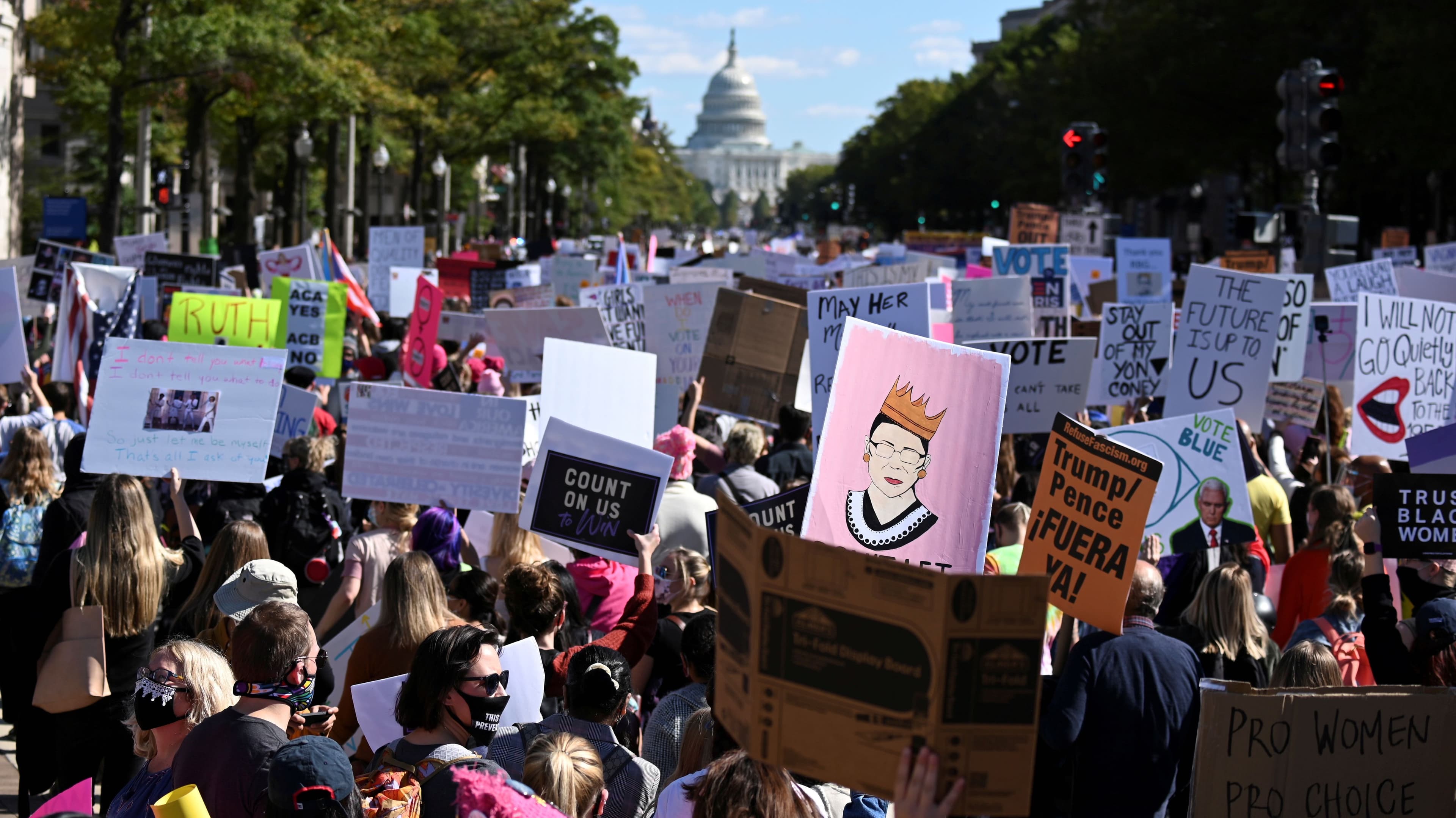 Women's March activists participate in a nationwide protest against US President Donald Trump's decision to fill the seat on the Supreme Court left by the passing of late Justice Ruth Bader Ginsburg before the 2020 election, in Washington, Oct. 17, 2020.