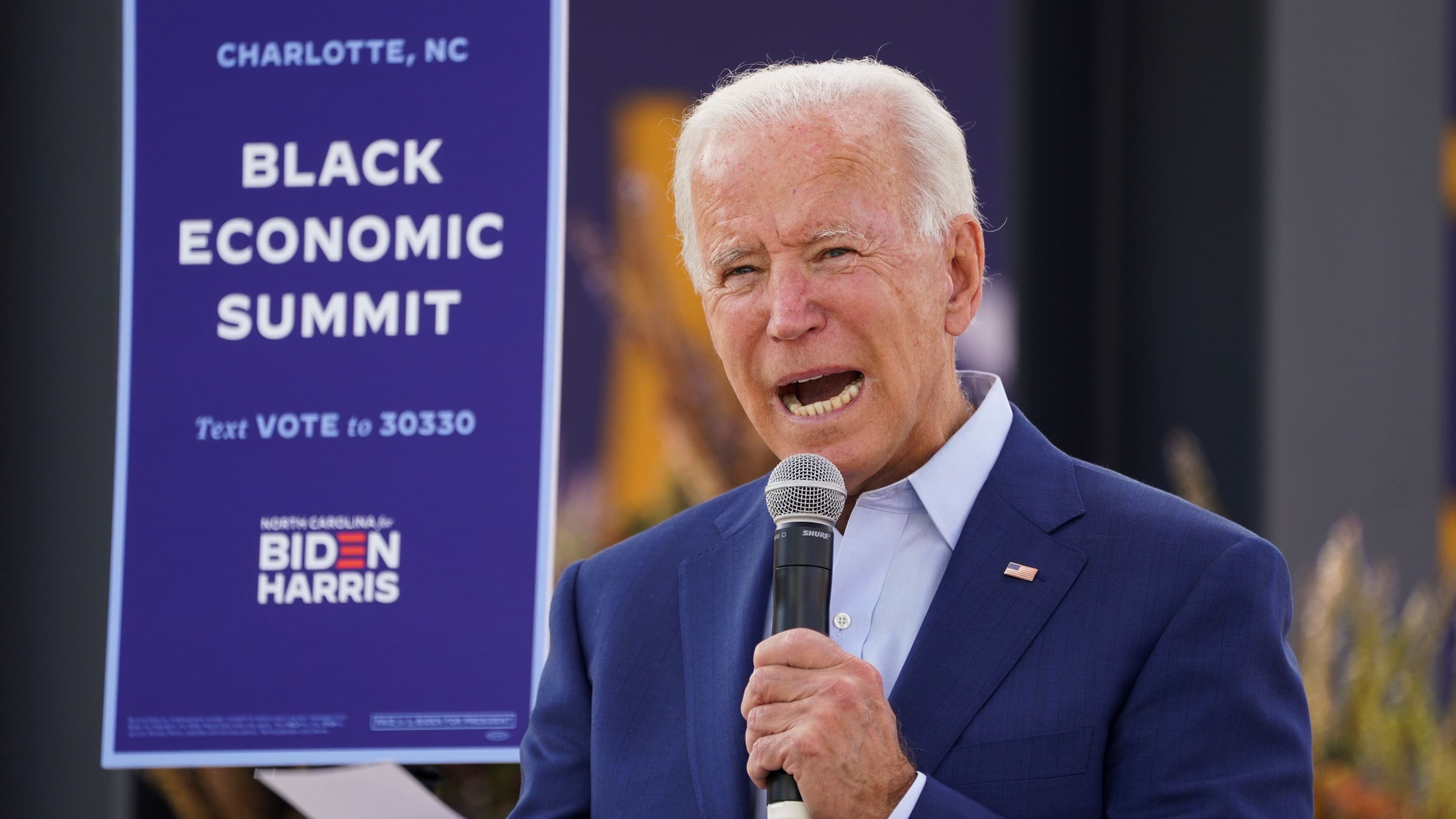 Democratic US presidential nominee Joe Biden speaks at an outdoor "Black Economic Summit" while campaigning for president in Charlotte, North Carolina, Sept. 23, 2020.