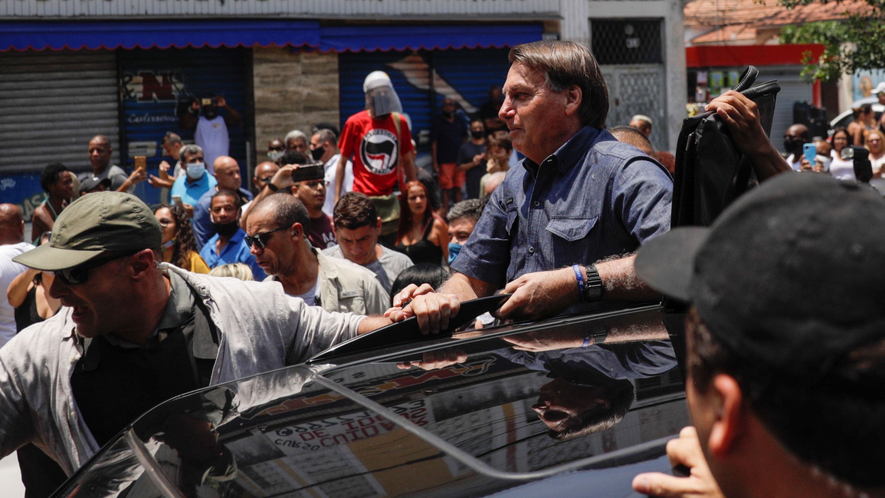 Brazil's President Jair Bolsonaro leaves after he voted during the municipal elections in Rio de Janeiro, Nov. 15, 2020.