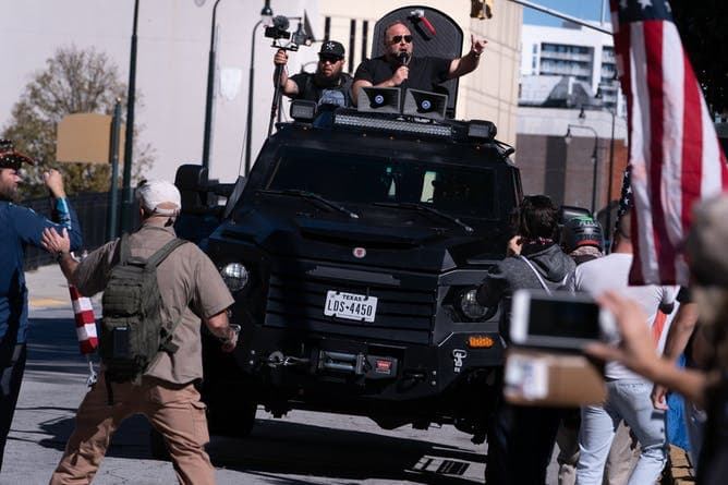 Pro-Trump supporters, including Infowars host Alex Jones, hold a ‘Stop The Steal’ protest in Atlanta as Georgia’s officials work to complete the state's recount of ballots.