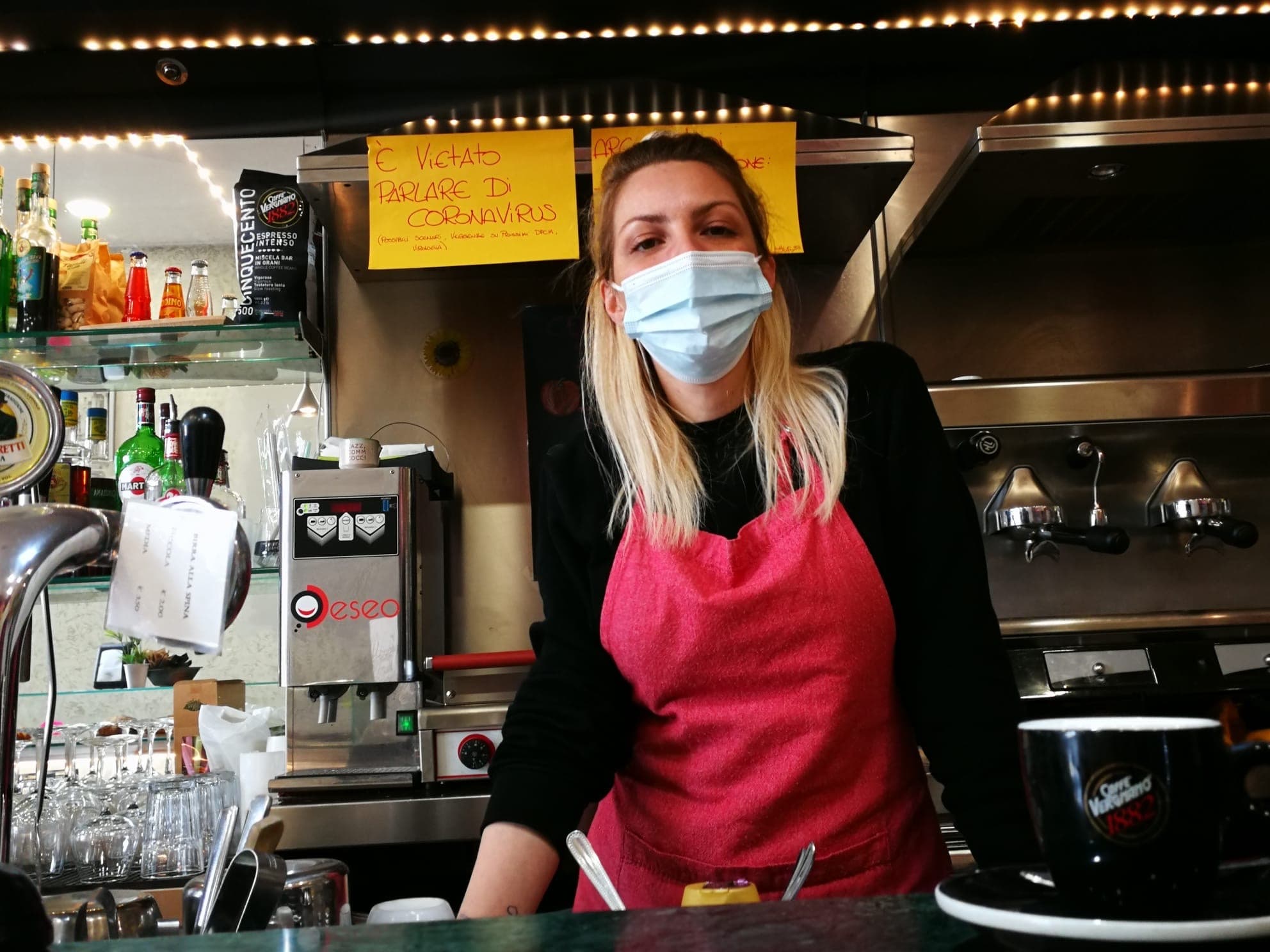 Bar owner Cristina Mattioli put up a sign asking patrons not to talk about COVID-19.