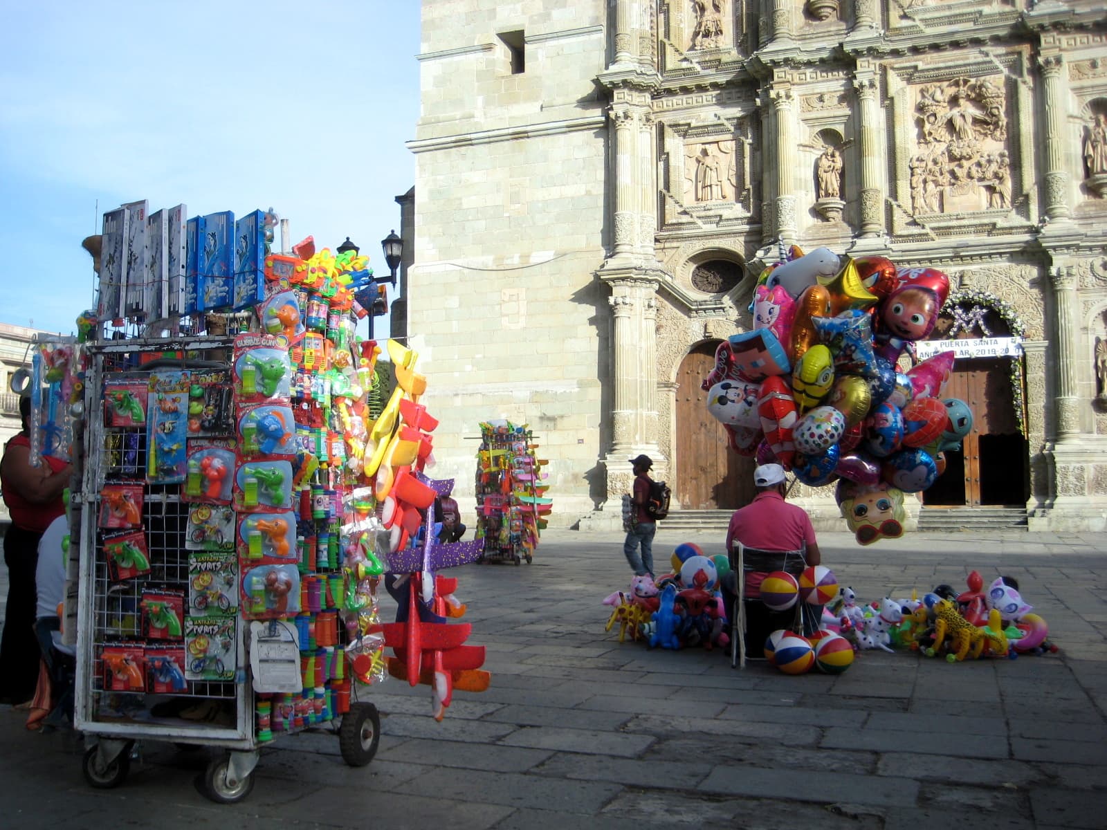 Vendors in front of Oaxaca's landmark cathedral have been outnumbering potential clients these days.