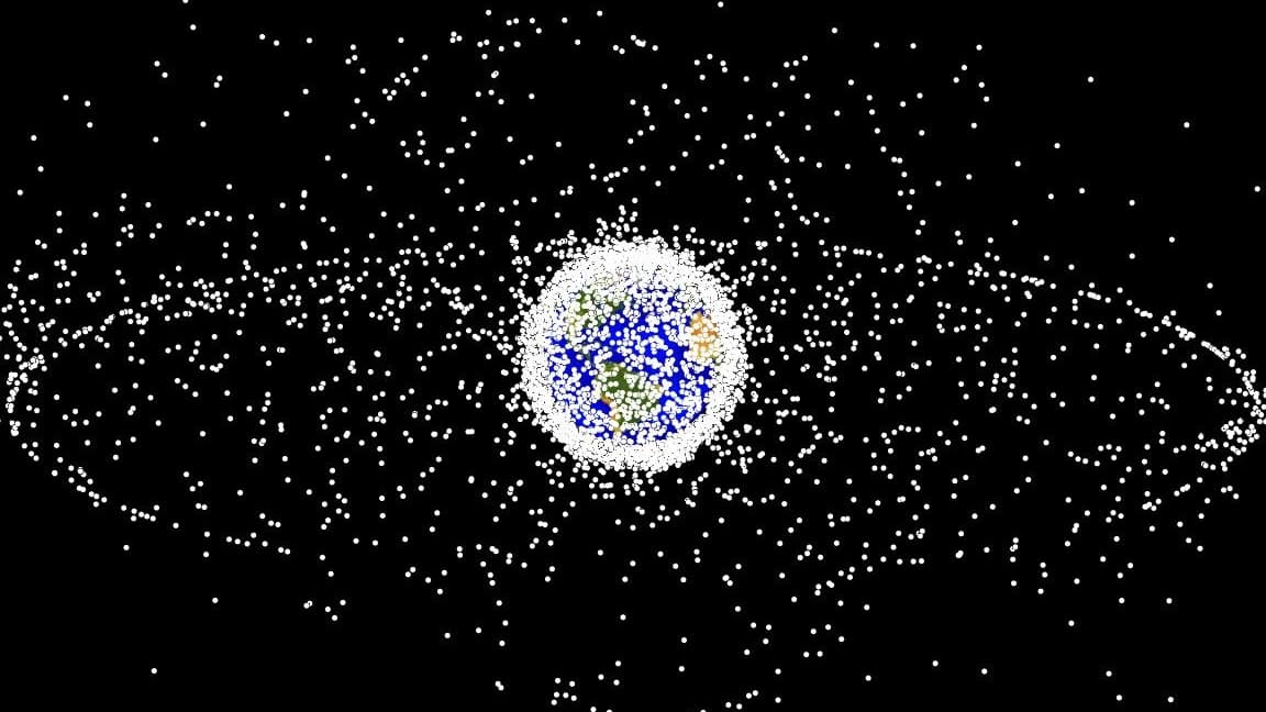 A blue ball in a black field surrounded by white, tiny dots.