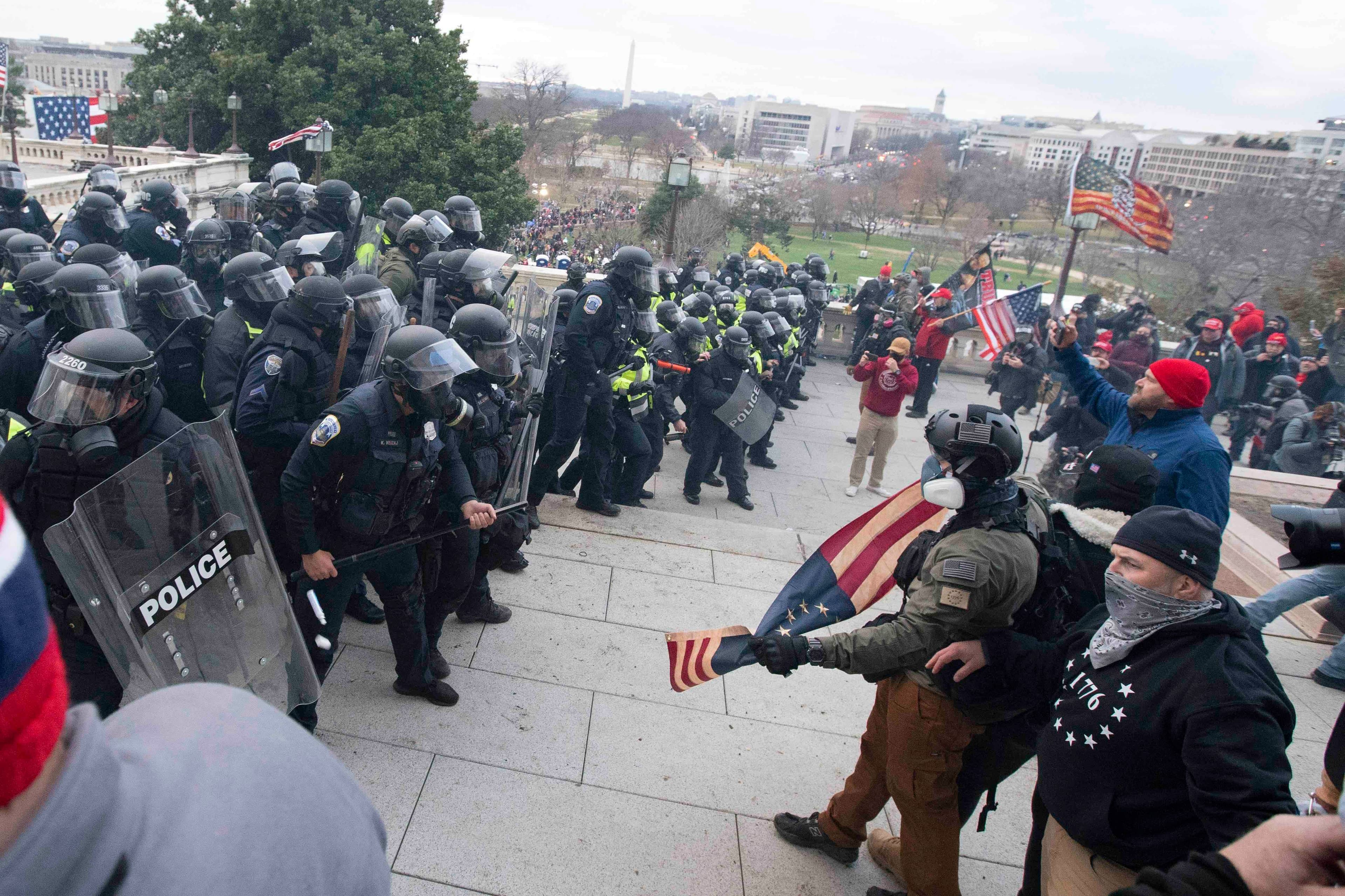 US Capitol Police push back rioters who were trying to enter the US Capitol on Wednesday, Jan. 6, 2021, in Washington, DC.