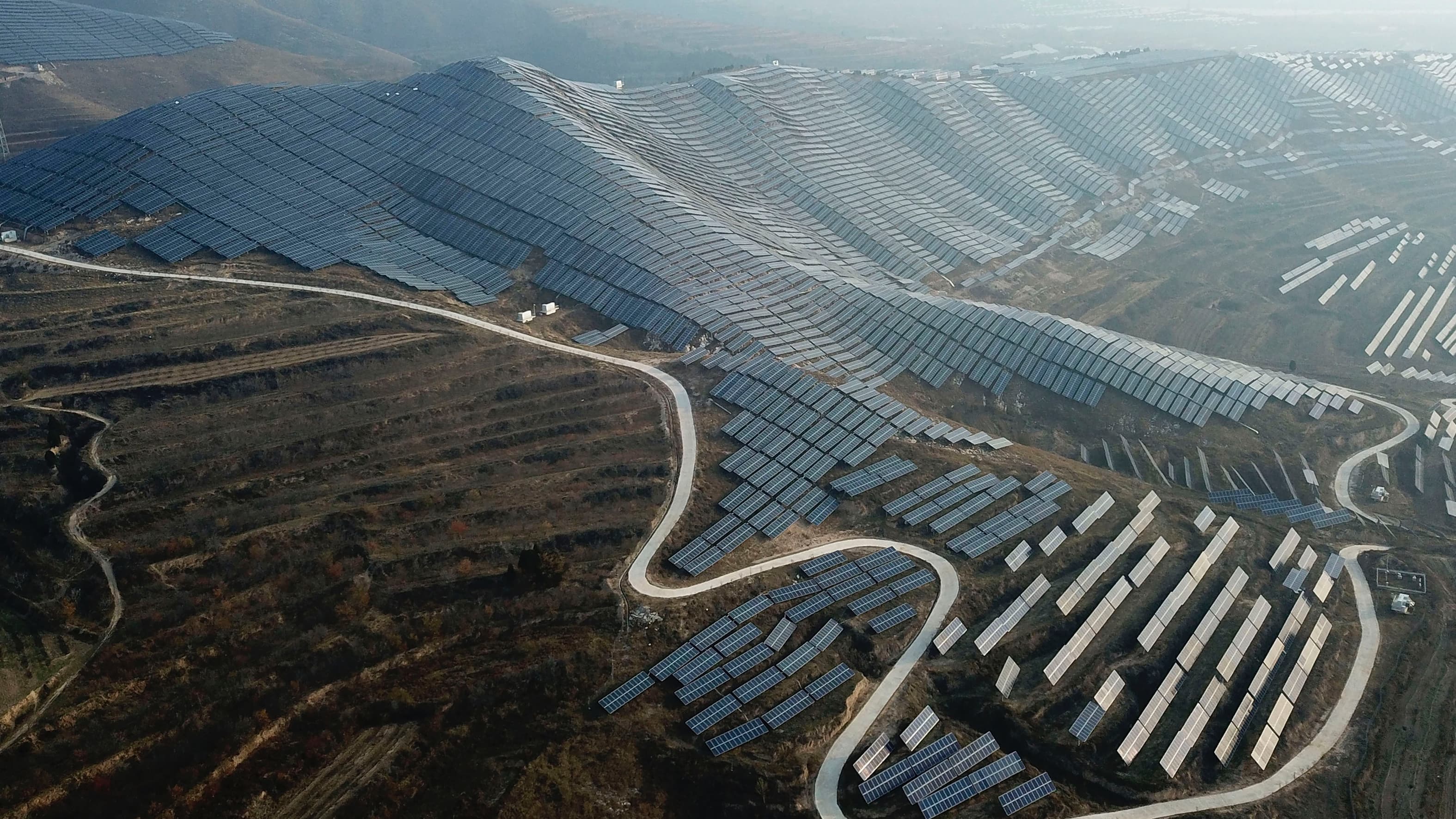 In this Nov. 28, 2019, photo, a solar panel installation is seen in Ruicheng County in central China's Shanxi Province.