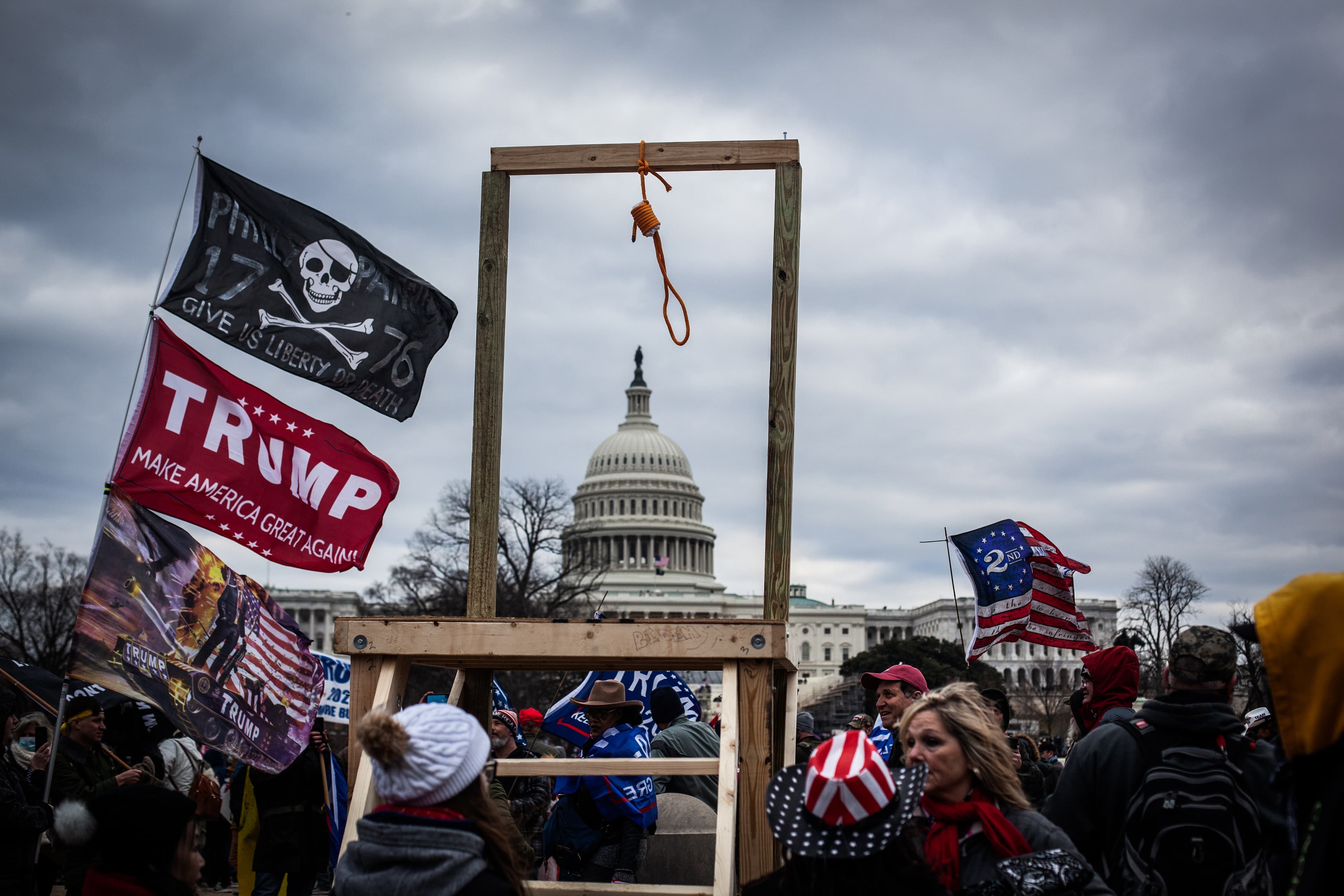 Crowds carrying hate symbols as they stormed the U.S Capitol on Jan. 6 in Washington, D.C.