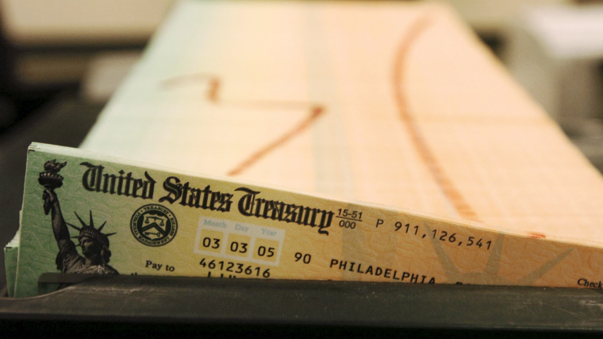 trays of printed social security checks from the US Treasury