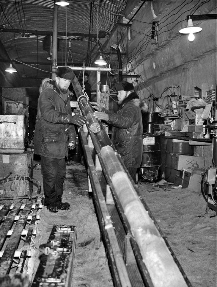Engineers pull up a section of the 4,560-foot-long ice core at Camp Century in the 1960s.