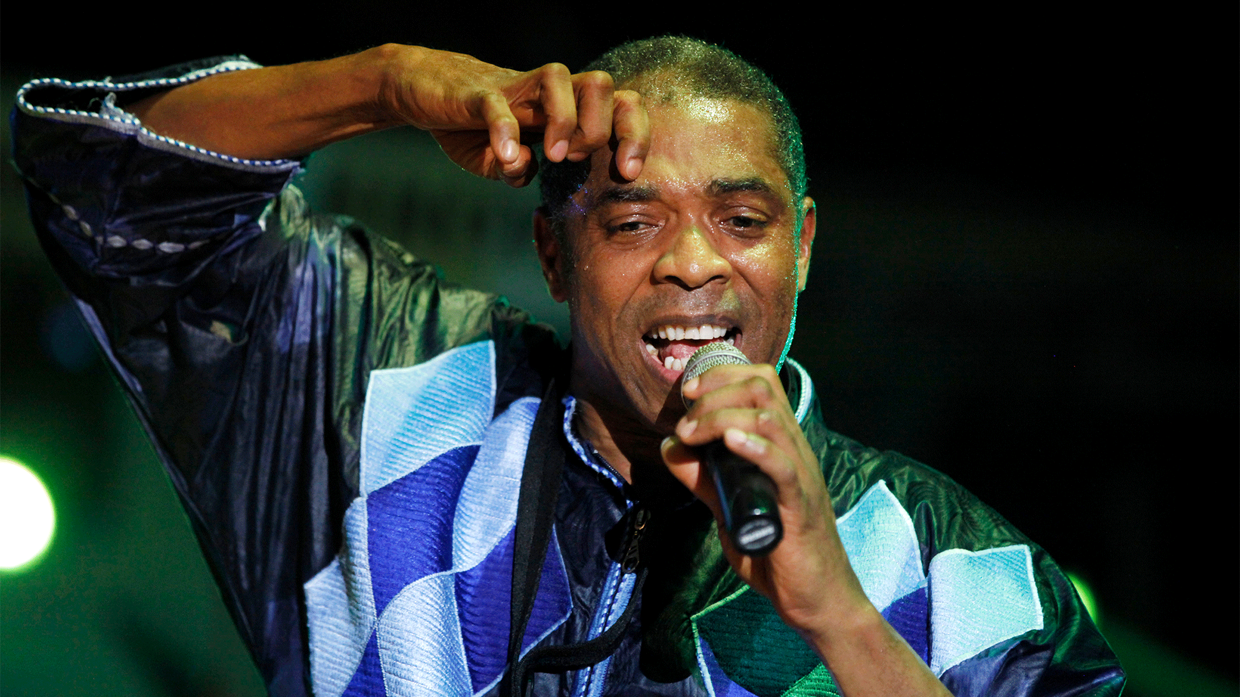 Nigerian Femi Kuti sings into a microphone