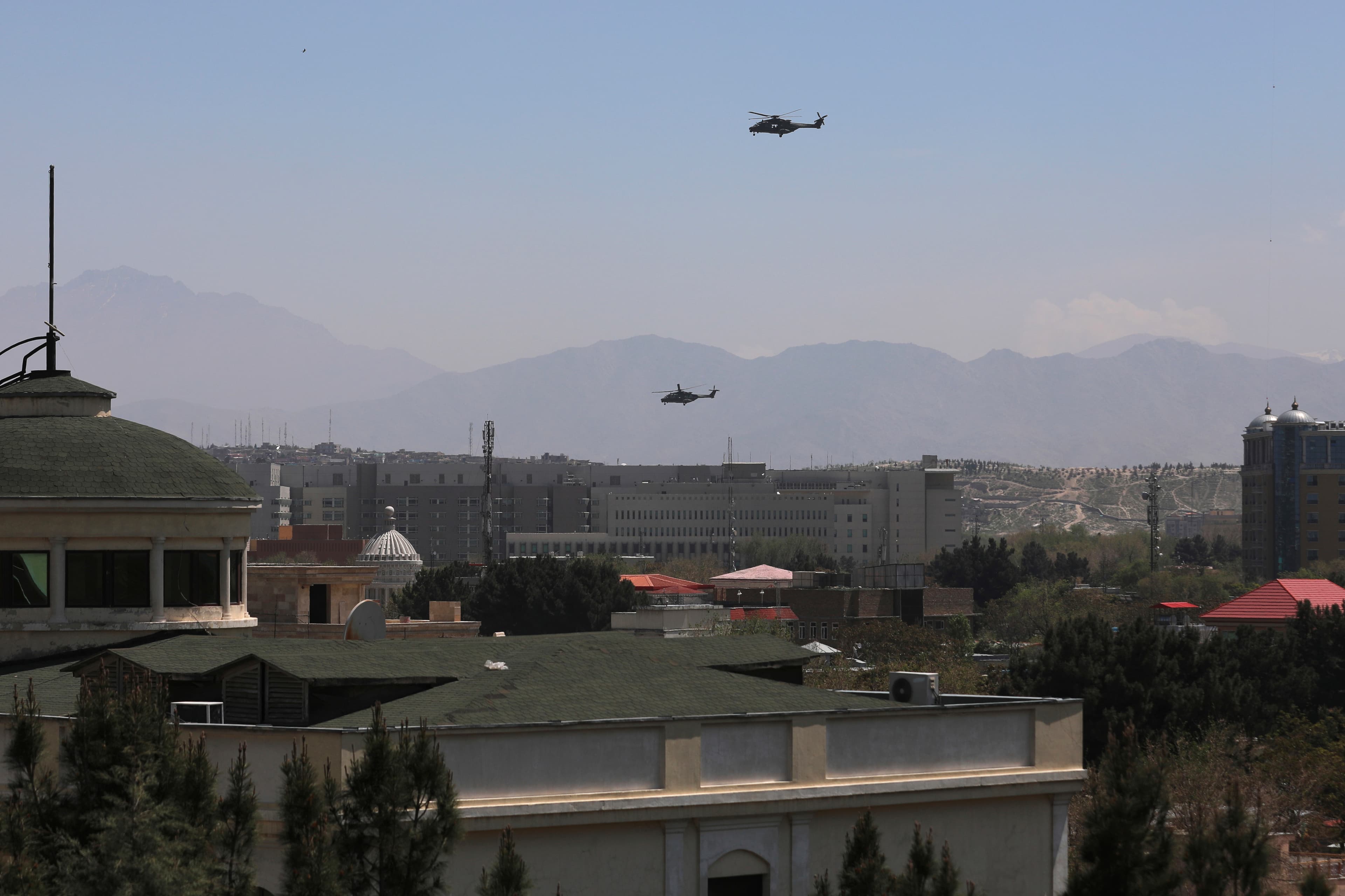 US Black Hawk military helicopters fly over the city of Kabul, Afghanistan, April 19, 2021.