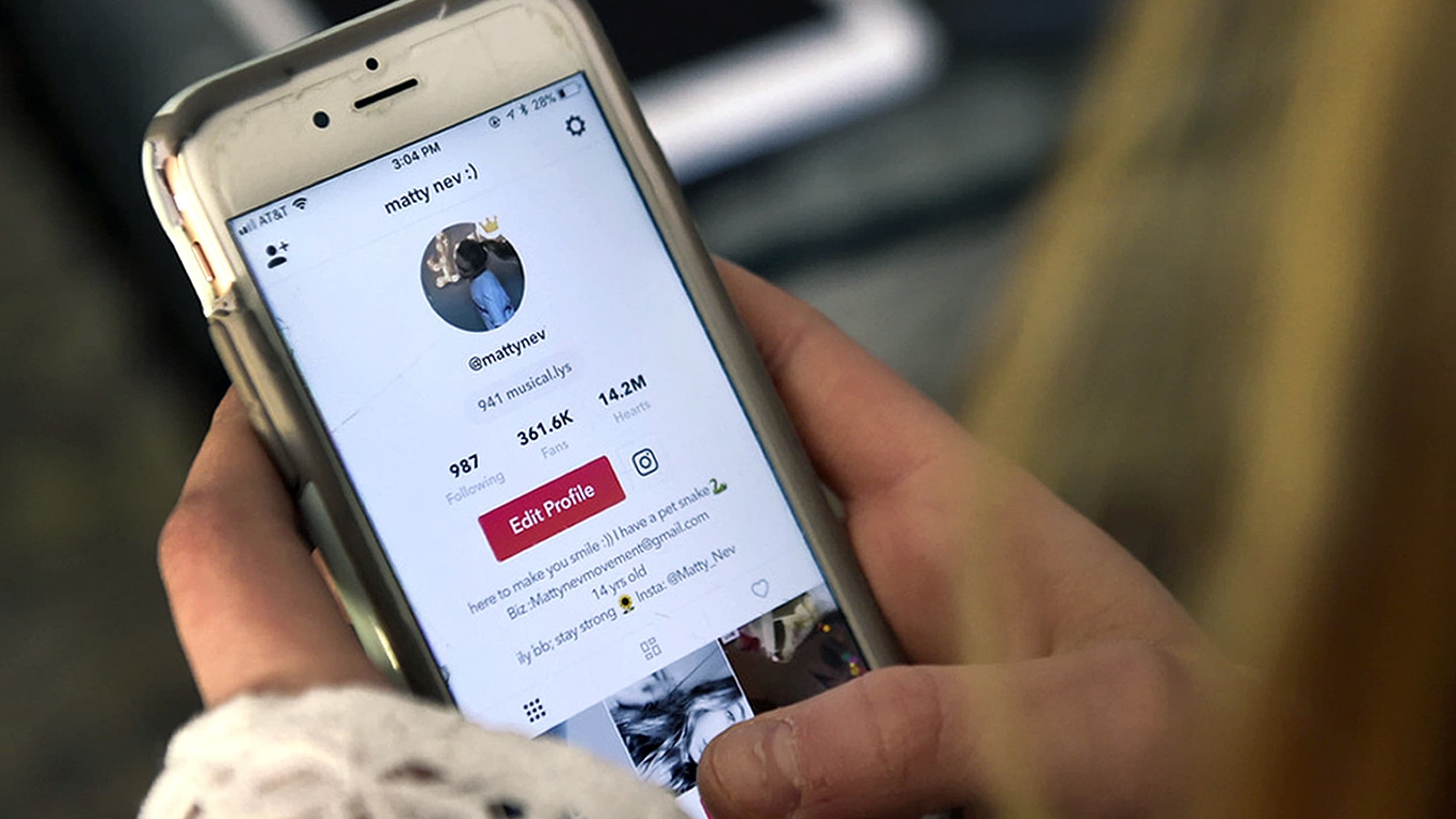 Teenager logs into social media app on phone