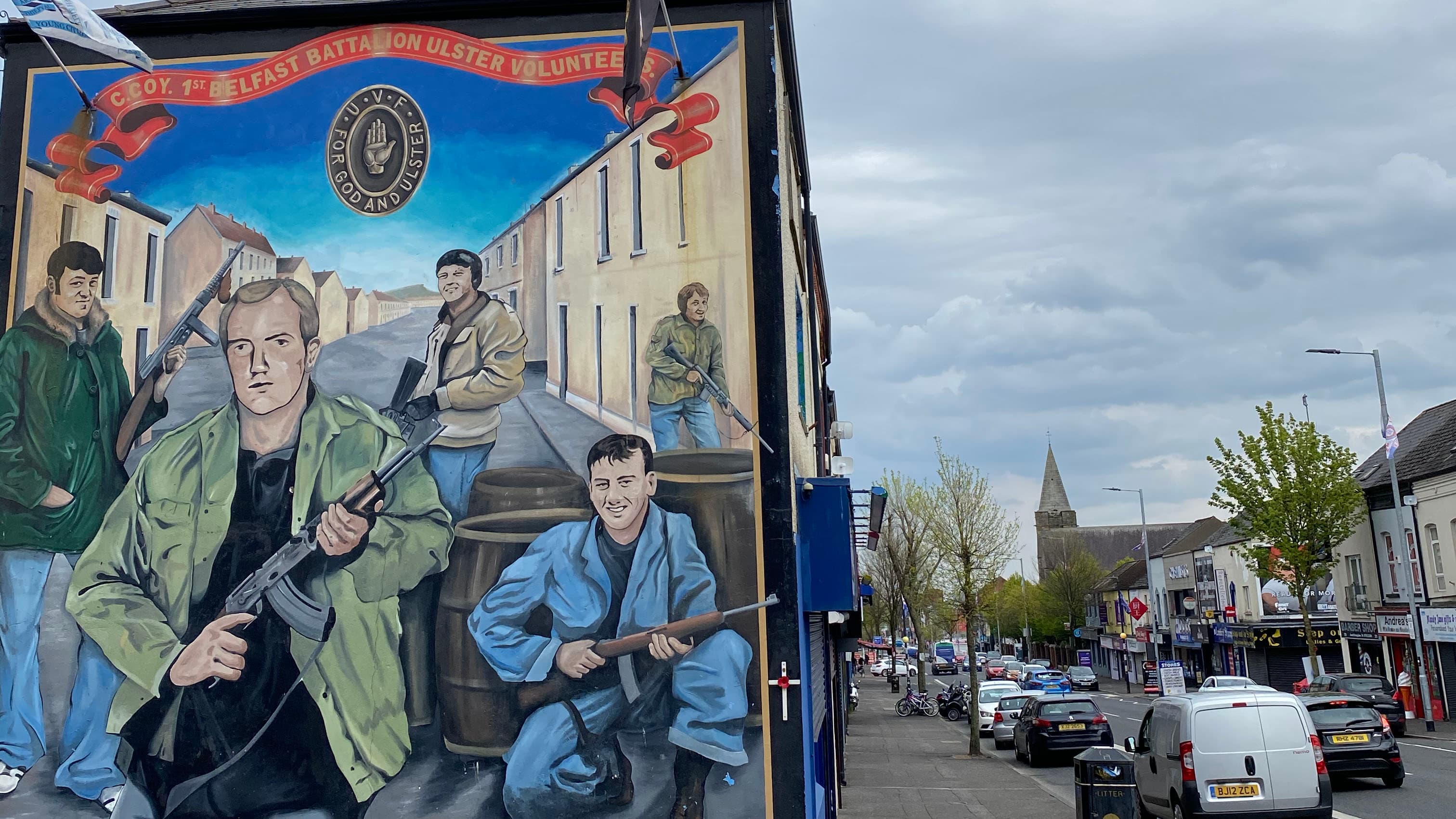 Areas of west Belfast are dominated by vivid murals depicting armed Loyalist and Republican paramilitary figures.