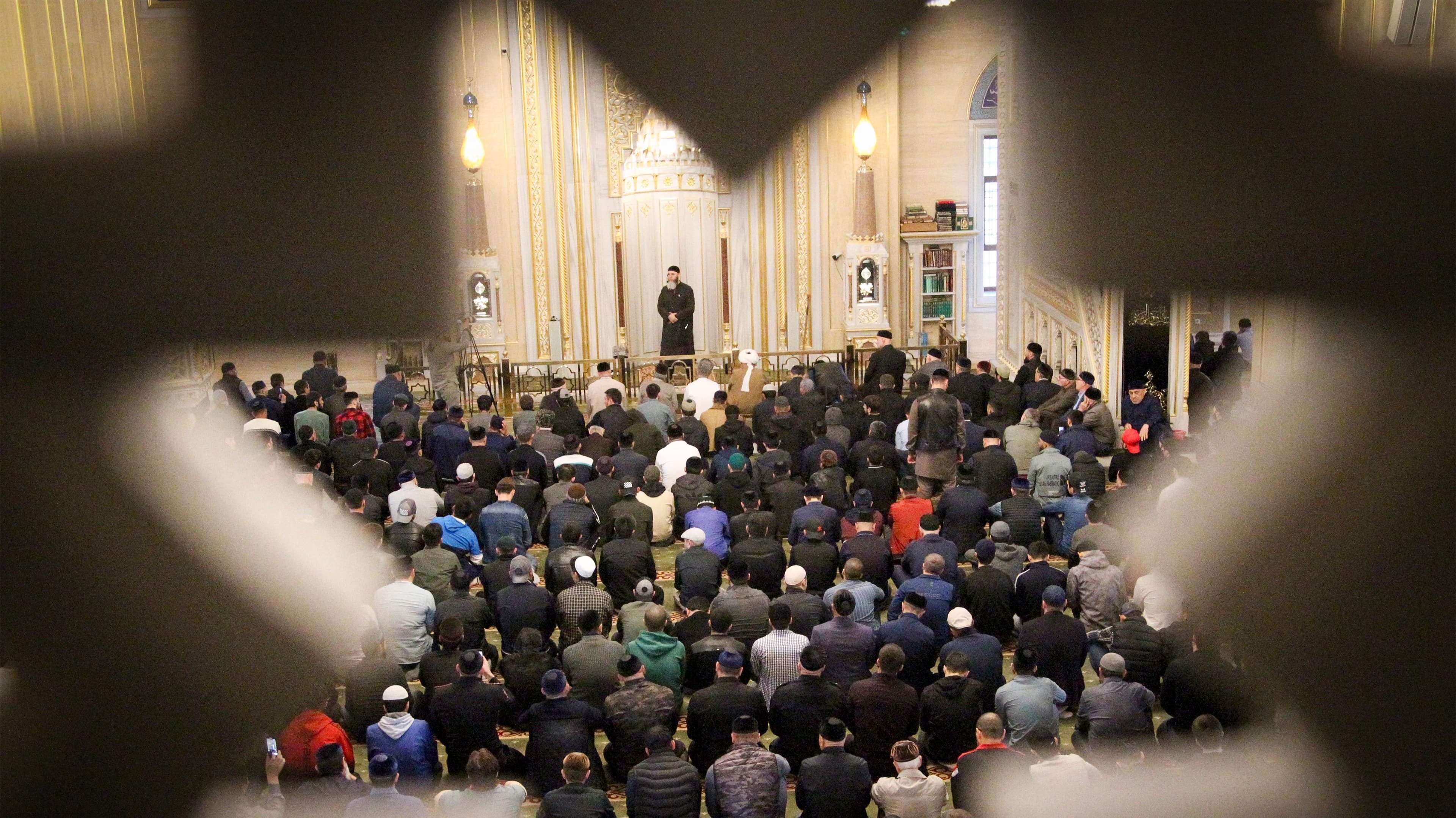 Muslims pray in a mosque during celebrations of Eid al-Fitr holiday, a feast celebrated by Muslims worldwide, in Grozny, Russia, on Thursday, May 13, 2021.