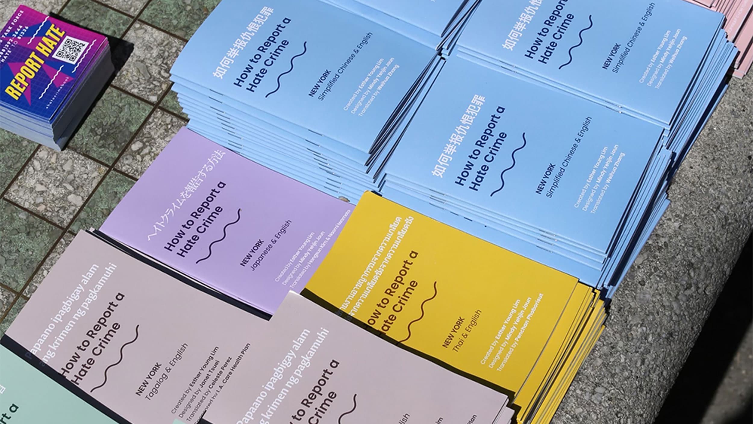 Colorful booklets in Asian languages on 'How to Report a Hate Crime'