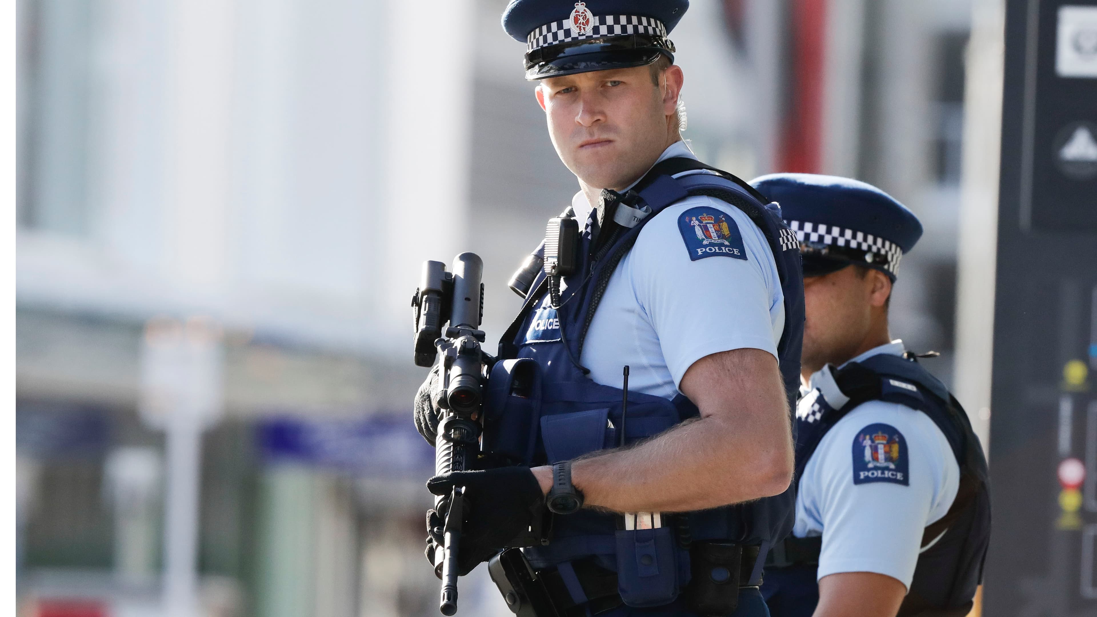 Police officers carry heavy, black guns.