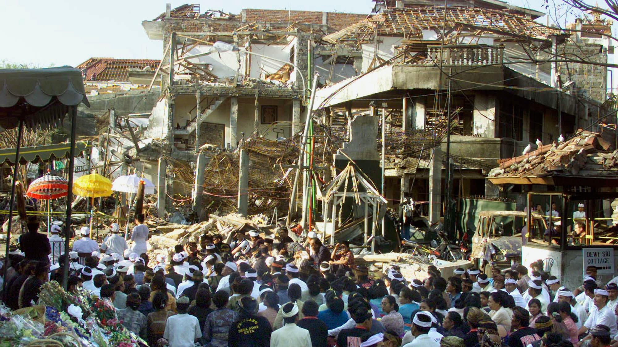 Local Balinese offer prayers for the victims at the site of the bomb blast in Kuta, Bali, Oct. 18, 2002. Nearly 200 people were killed and more than 300 were injured in the nightclub bombing. 