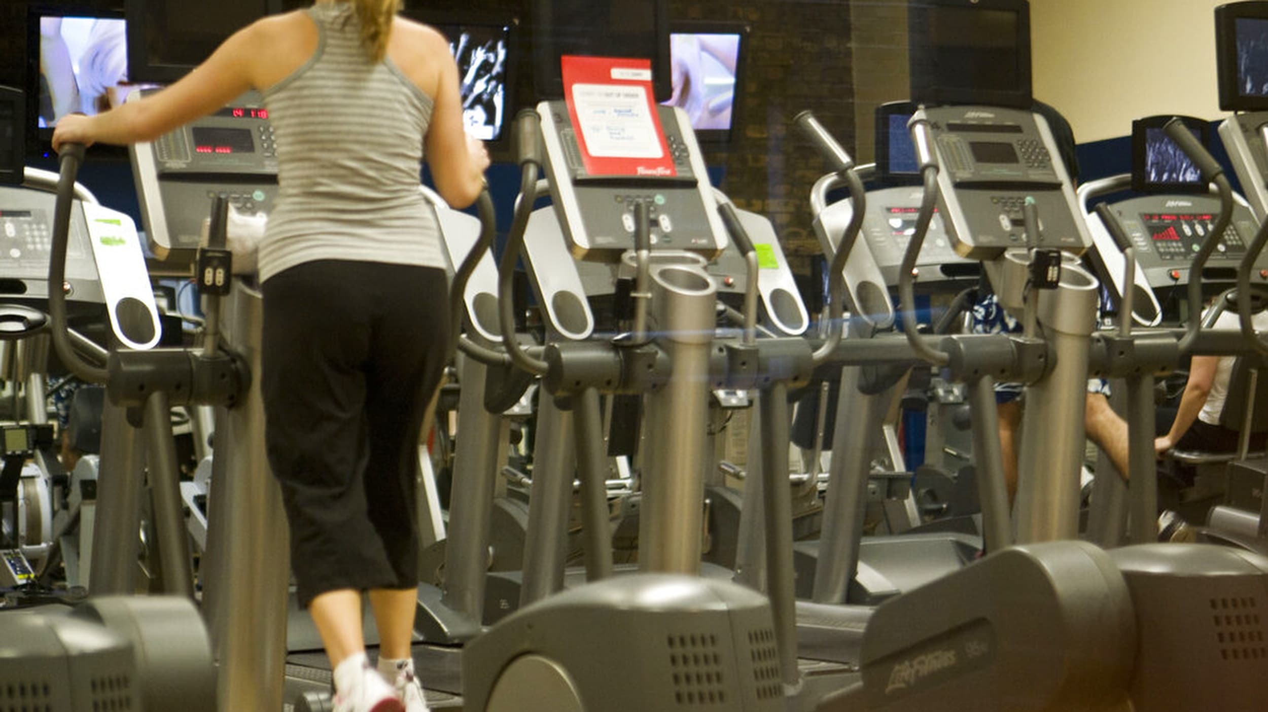 Woman in a gym on an exercise machine