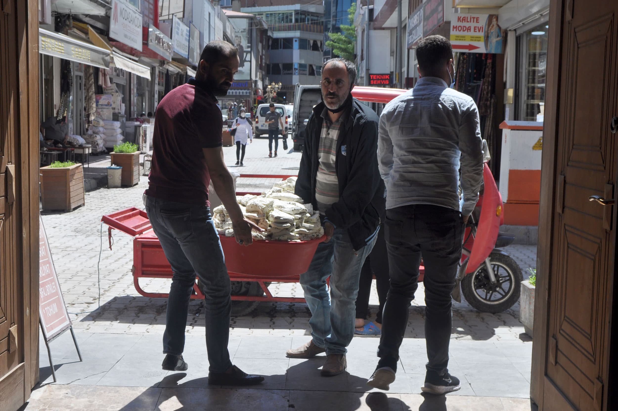 Workers bring in a shipment of regional Van cheese on a weekday morning, before the market gets busy.