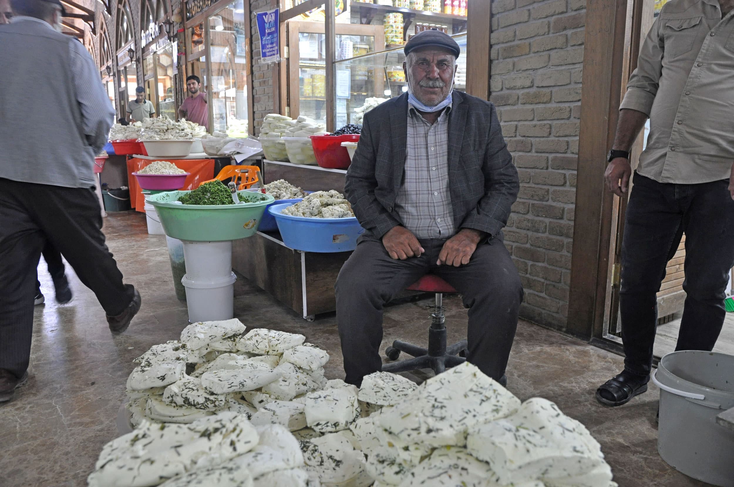 A cheese producer who gave just his first name, Islam, sits with 150 kilograms of Van Otlu Peyniri.