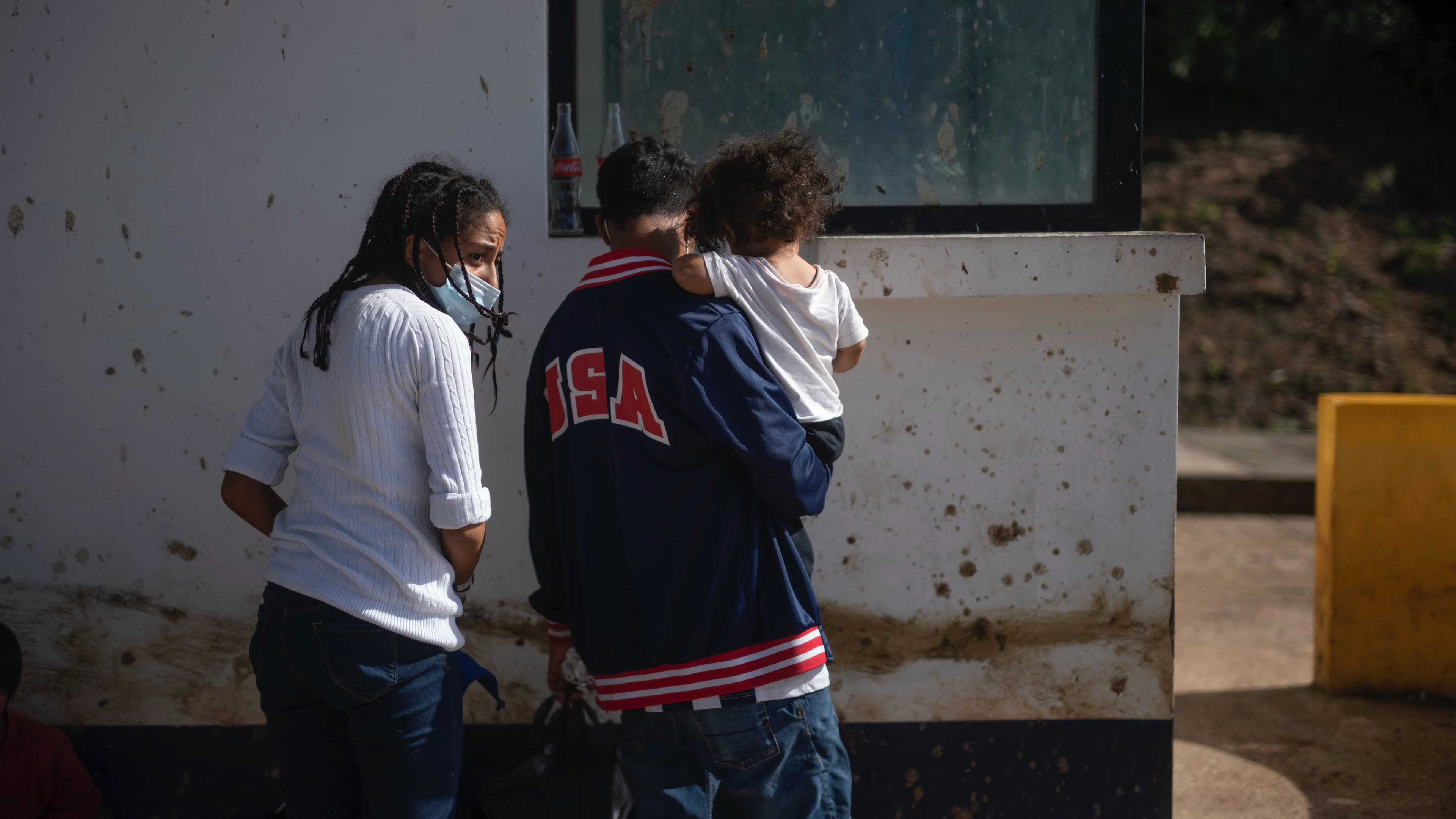 Honduran migrants Bianca Emerita Galvan, 22, left, and Dani Omar Suazo, 21, holding their son 1-year-old sone Daniel Emir, arrive at El Ceibo, Guatemala, Aug. 12, 2021, after being deported by air from the US to Mexico and then shipped into Guatemala by l