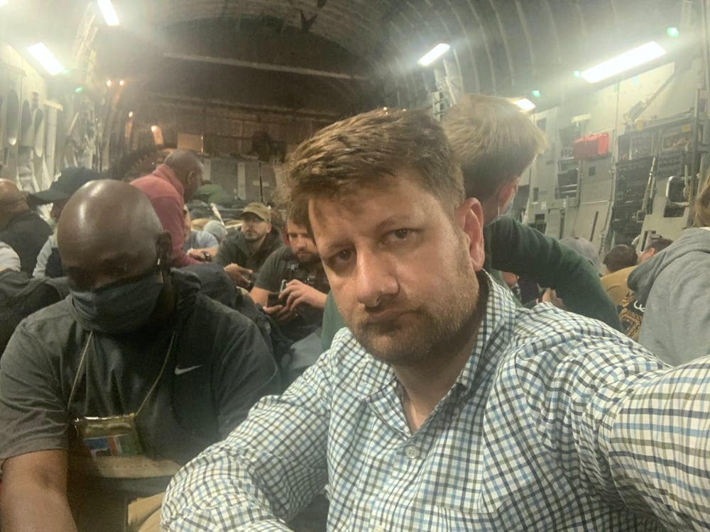 Selfie of Sufizada seated inside a crowded transport