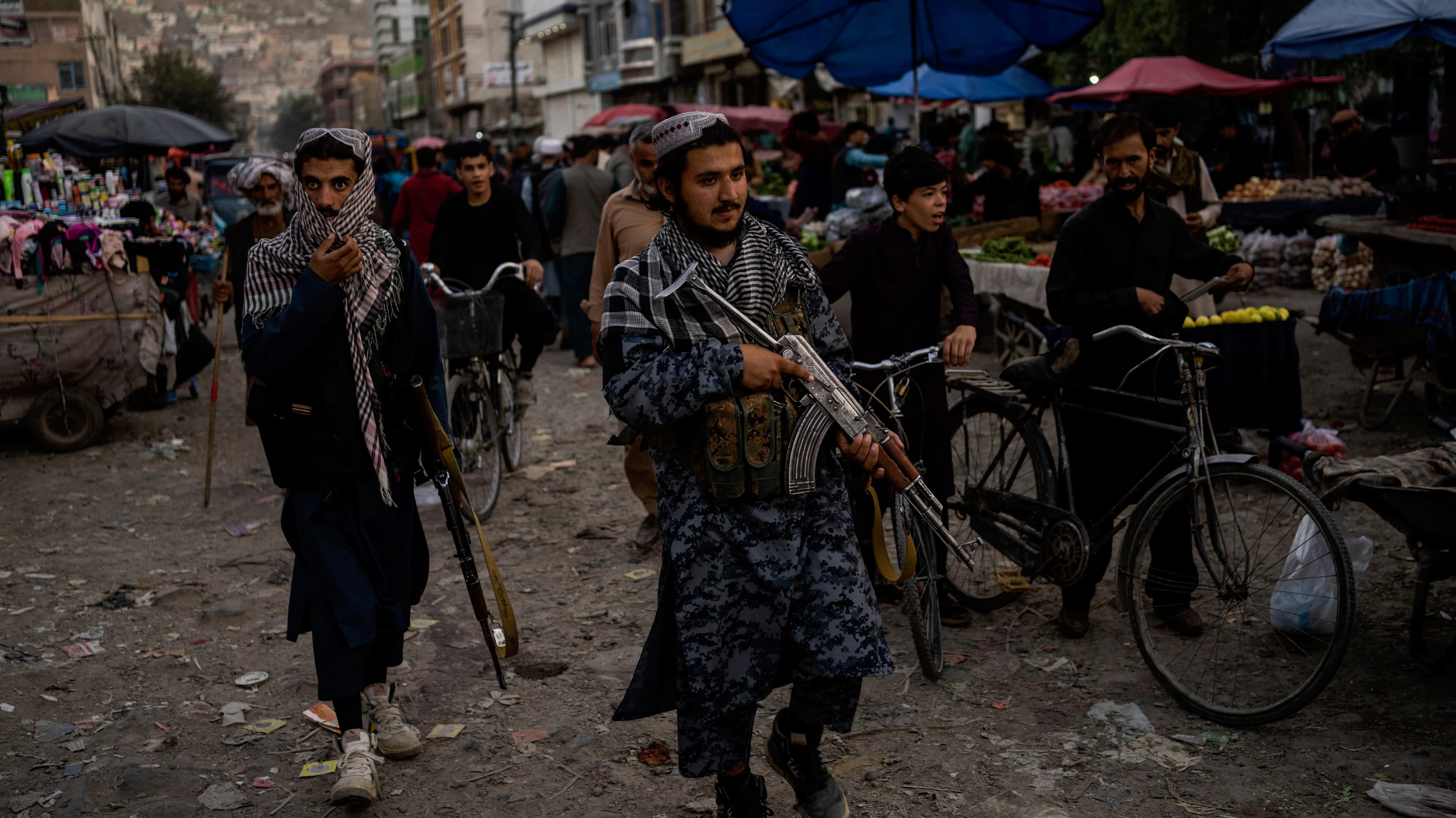 Taliban fighters patrol a market in Kabul's Old City, Afghanistan, Sept. 14, 2021.