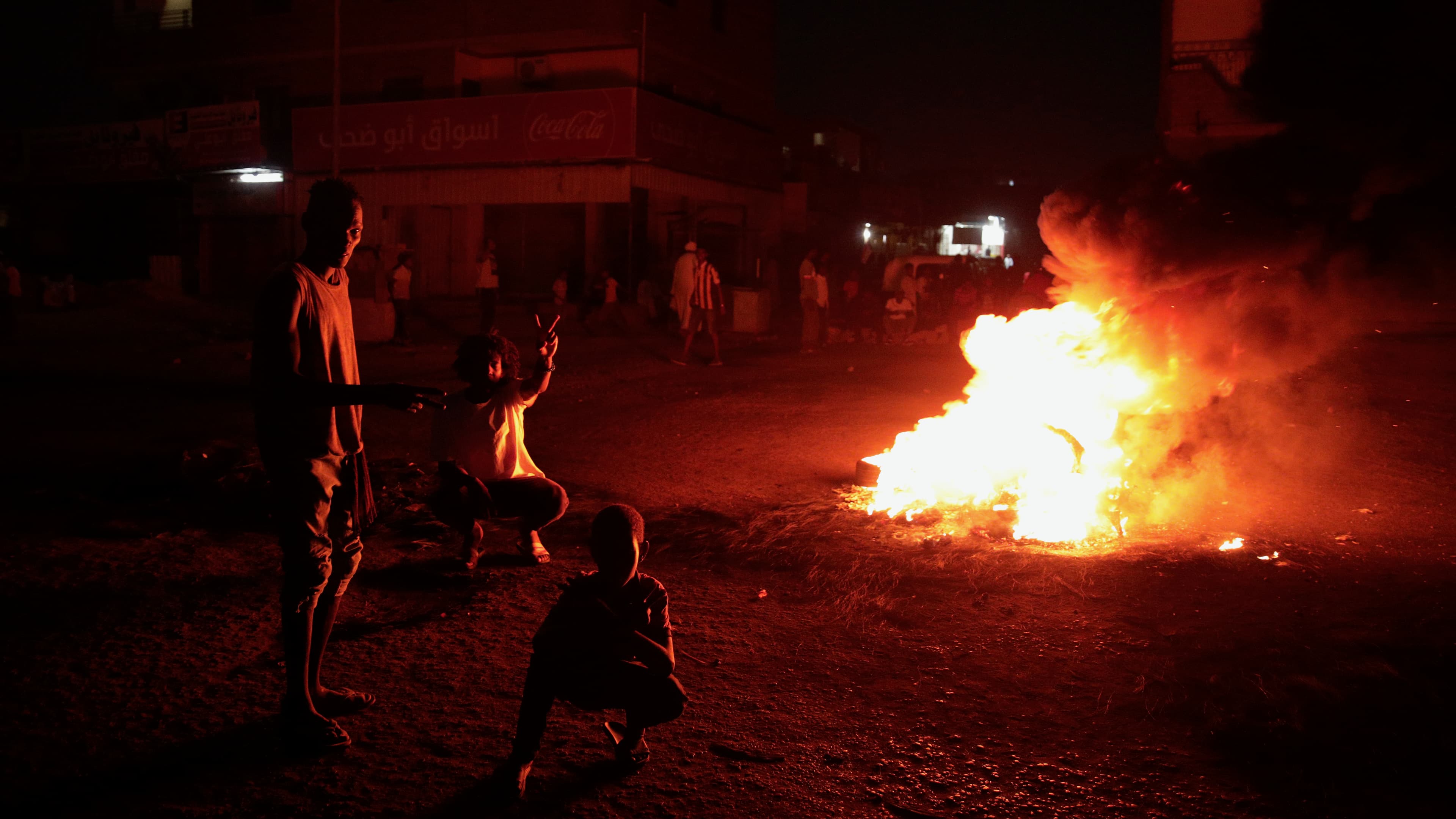 People protest in Khartoum, Sudan, two days after a military coup, Oct. 27, 2021. The coup threatens to halt Sudan's fitful transition to democracy, which began after the 2019 ouster of longtime ruler Omar al-Bashir and his Islamist government in a popula