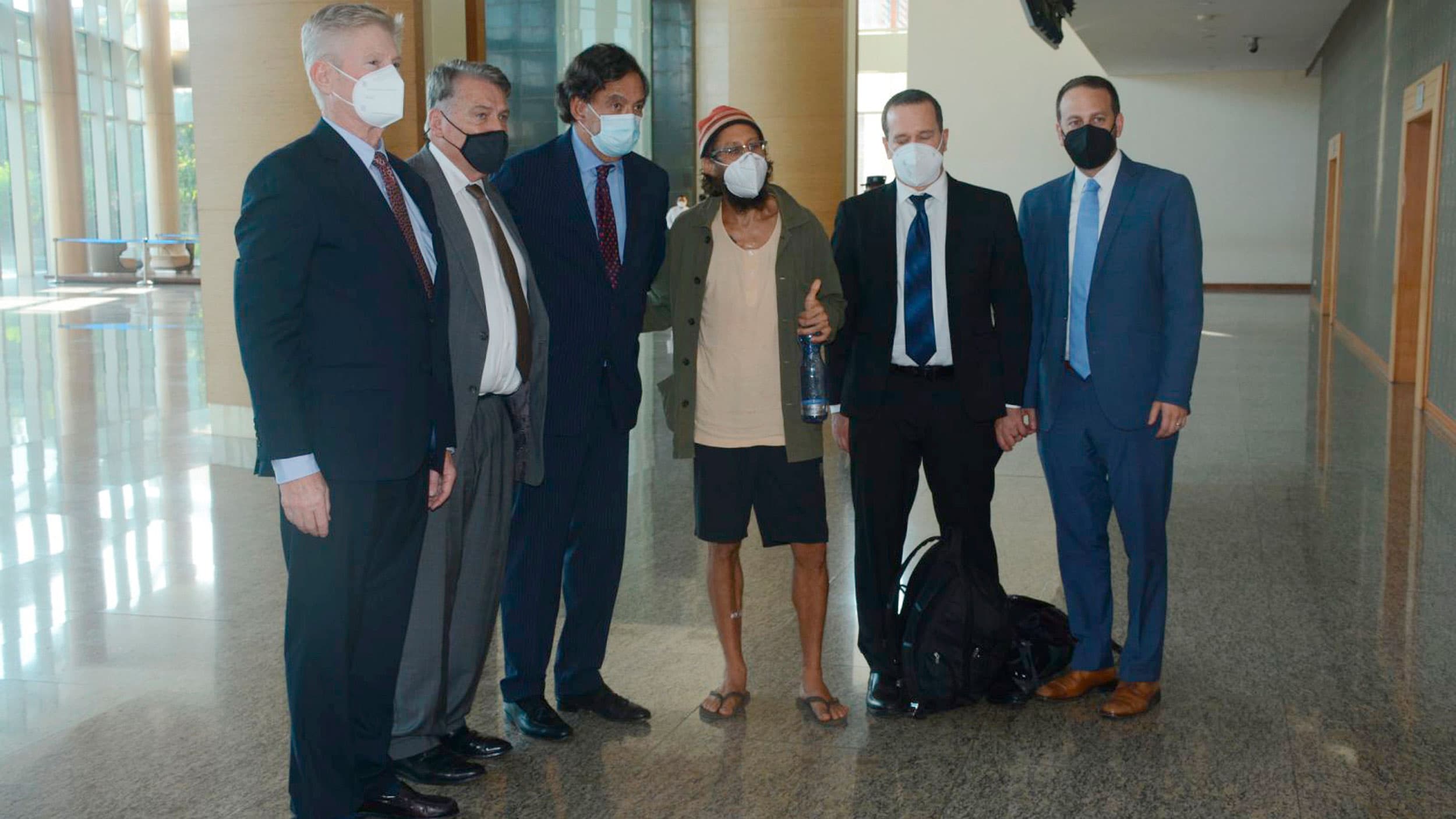 Released American journalist Danny Fester, centre, poses next to former US Ambassador to the UN Bill Richardson, third from left and members of his team at the Naypyitaw Airport in Naypyitaw, Myanmar
