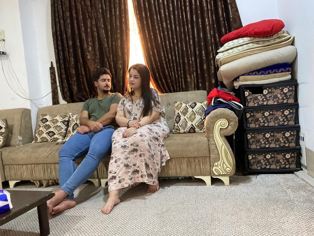 Bria Ali, 21, and Abdelrahman Ali, 19, discuss their future after being deported from Poland when trying to reach Western Europe. November 24, 2021. Credit: Yasmine Mosimann/ The World