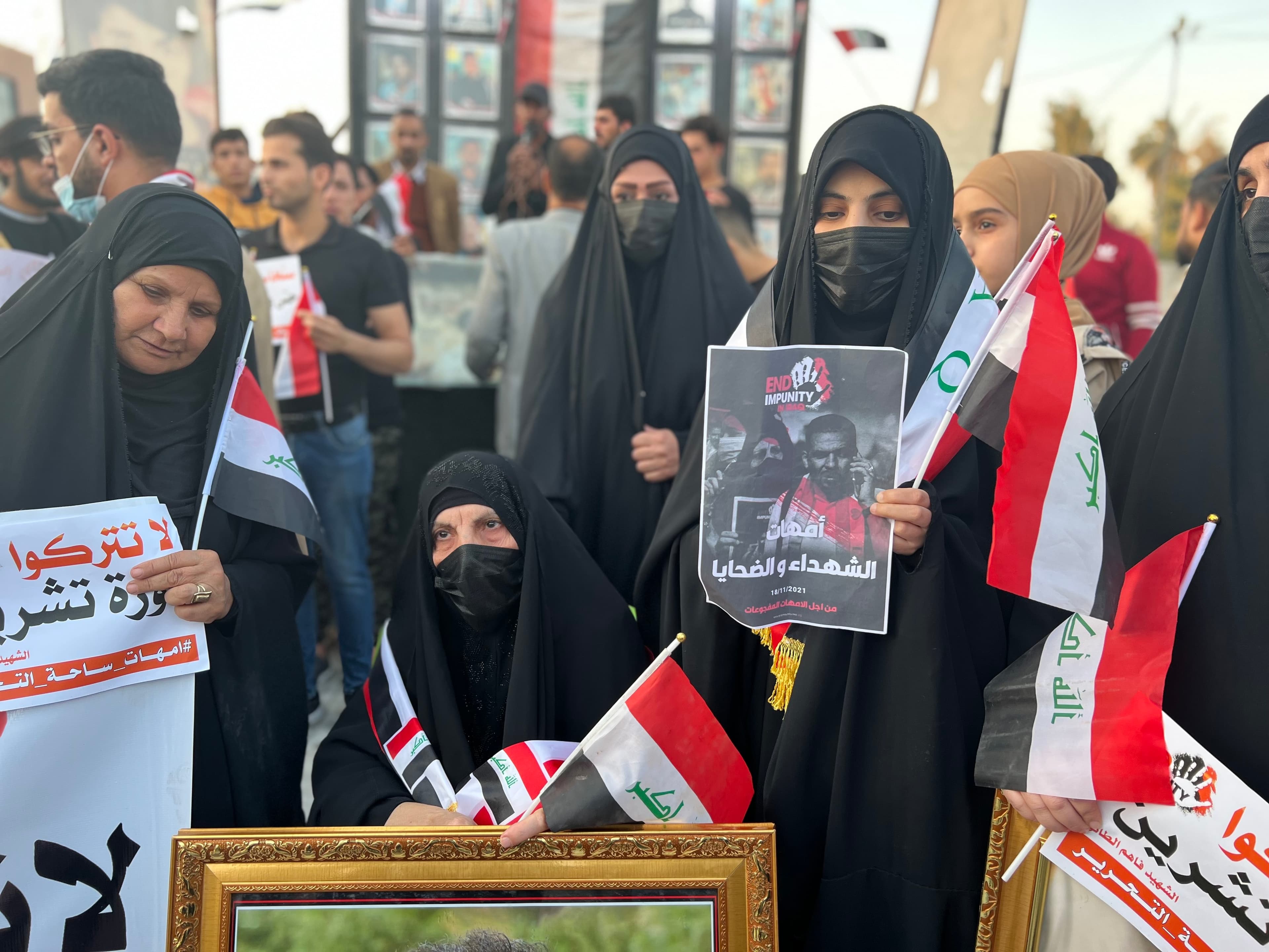 Samira Abbas, whose activist son Ehab al-Wazni was assassinated in May, attends a demonstration in Karbala on Nov. 18, 2021, with other women protesting the impunity Iraqi activists face.