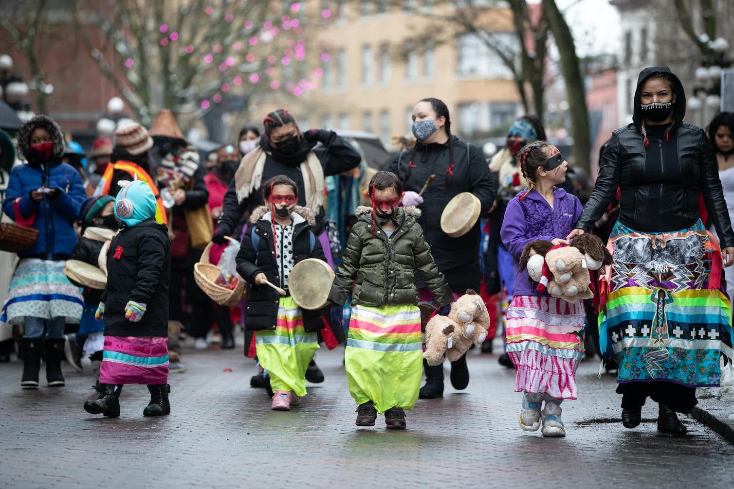 Young girls walk together during a march