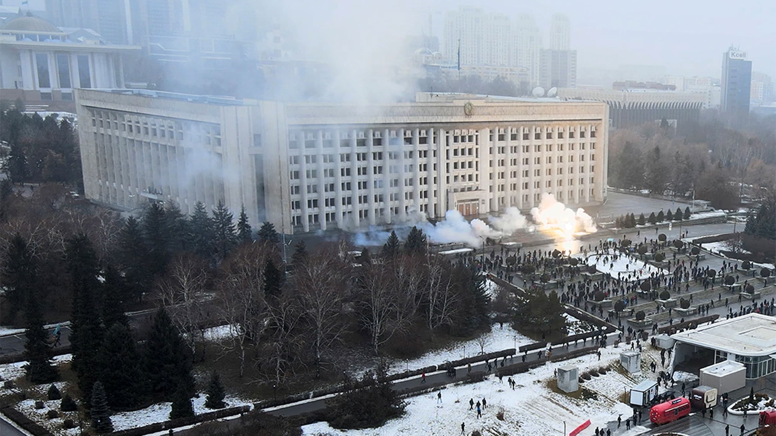 Smoke rises from the city hall building during a protest in Almaty, Kazakhstan
