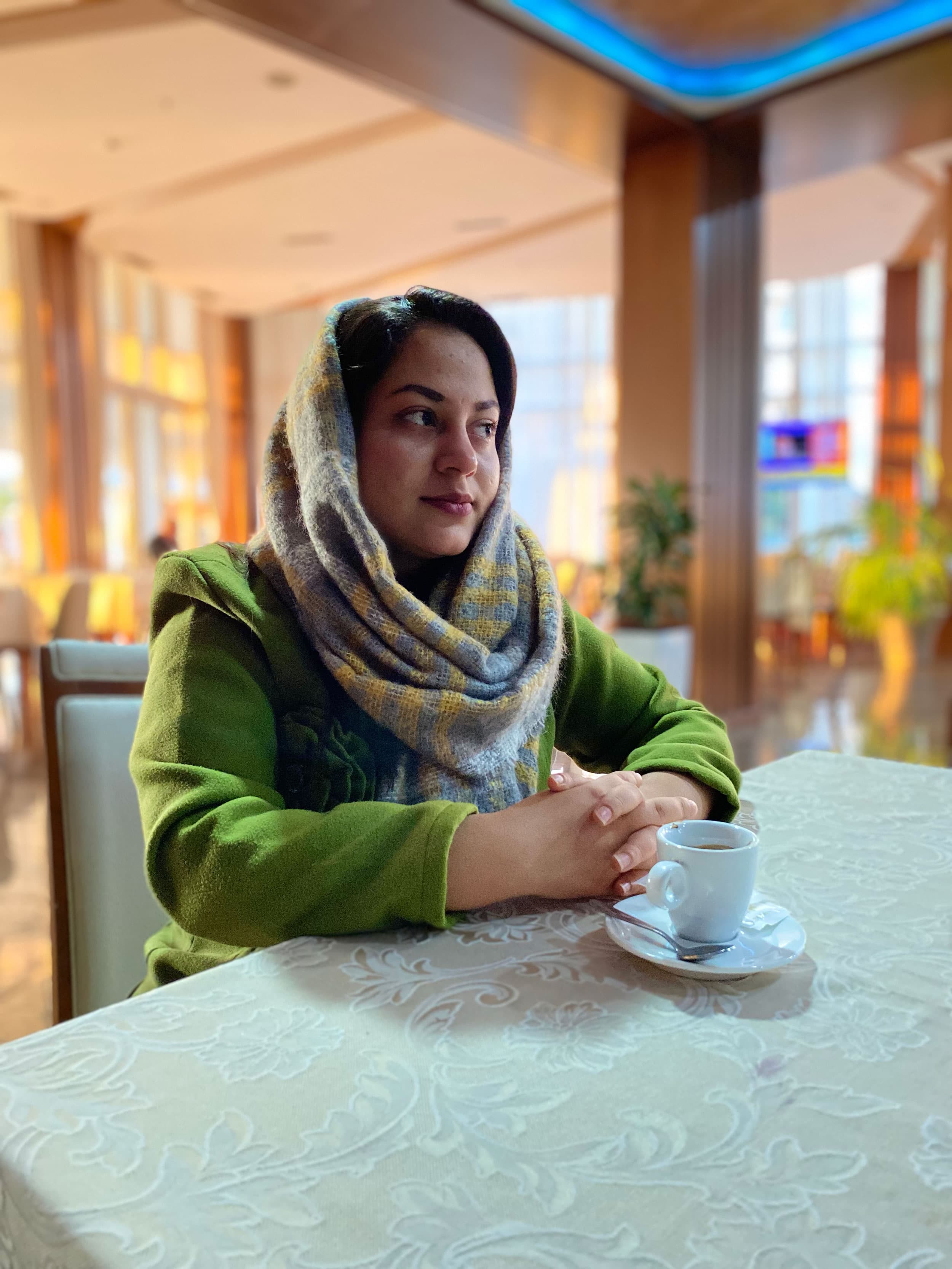 Mina Raoufi is a media professional and aspiring Olympic weightlifter waiting in limbo at the upscale Rafaelo in Albania. 