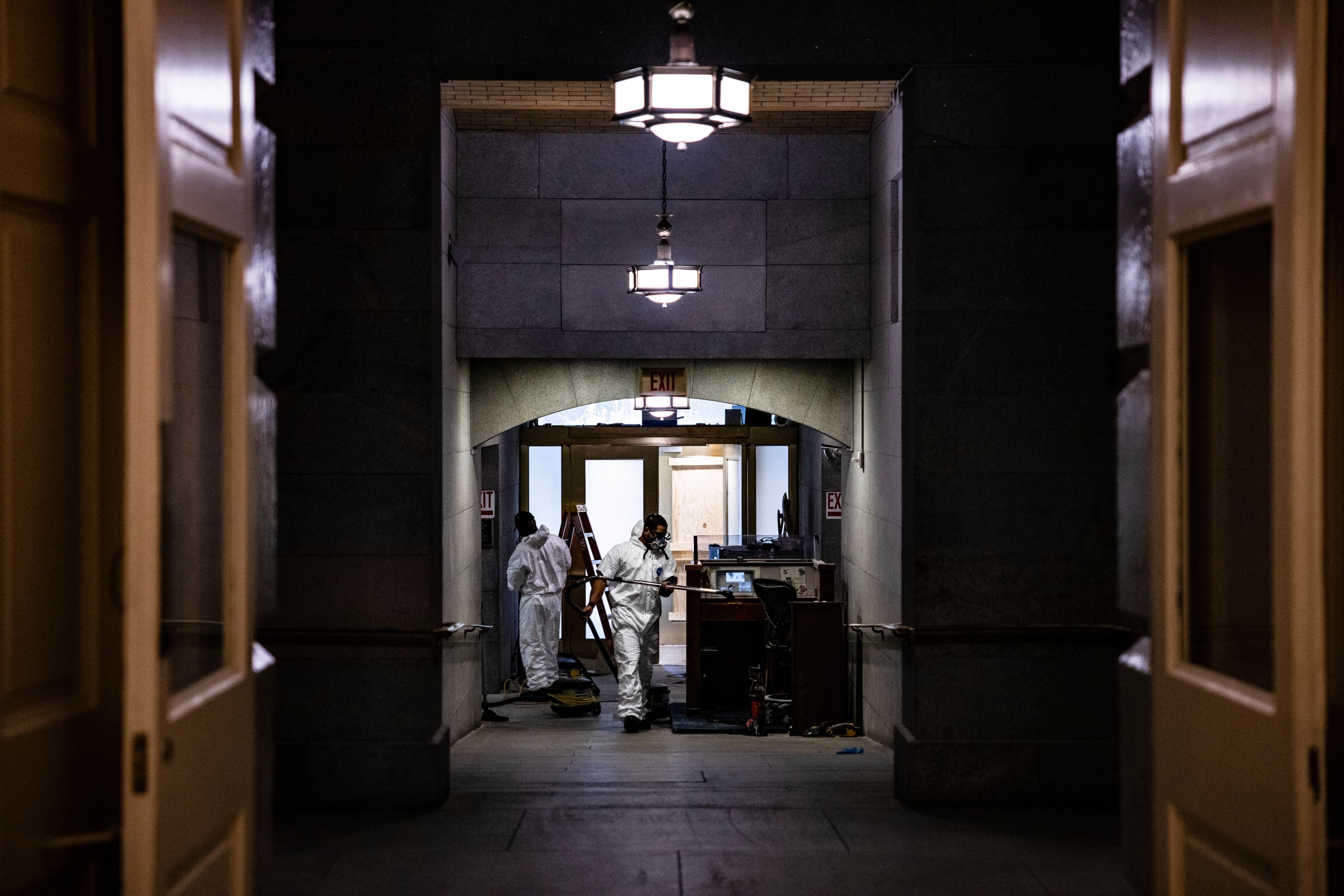 The day after the U.S. Capitol was stormed, workers begin to clean up the debris and damage estimated at $2.5 million.