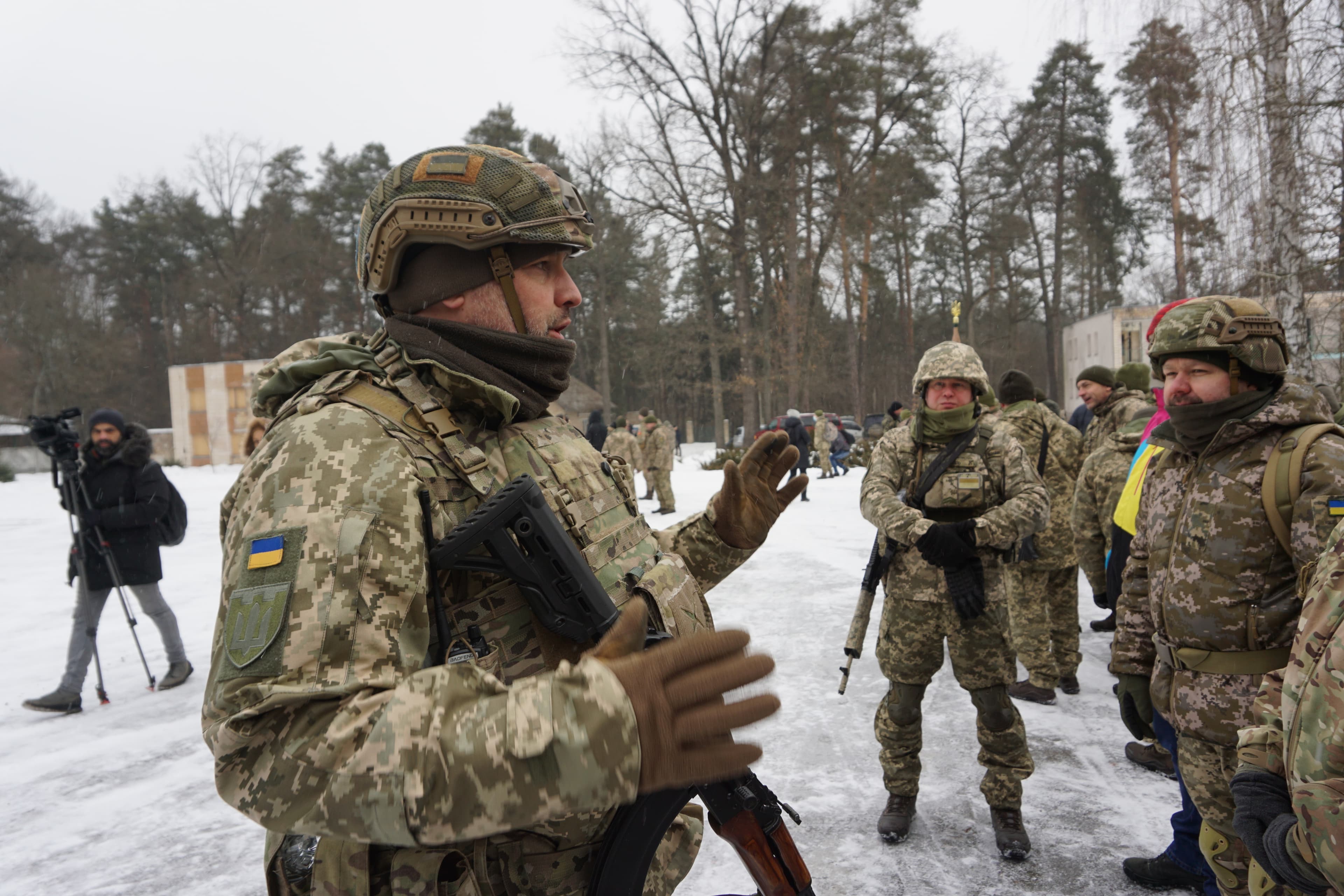 At a “territorial defense training” on the outskirts of Kyiv, Ukraine, civilian volunteers learn how to be soldiers. They practice with replica rifles or wooden cutouts in the shape of rifles and moving through different positions.