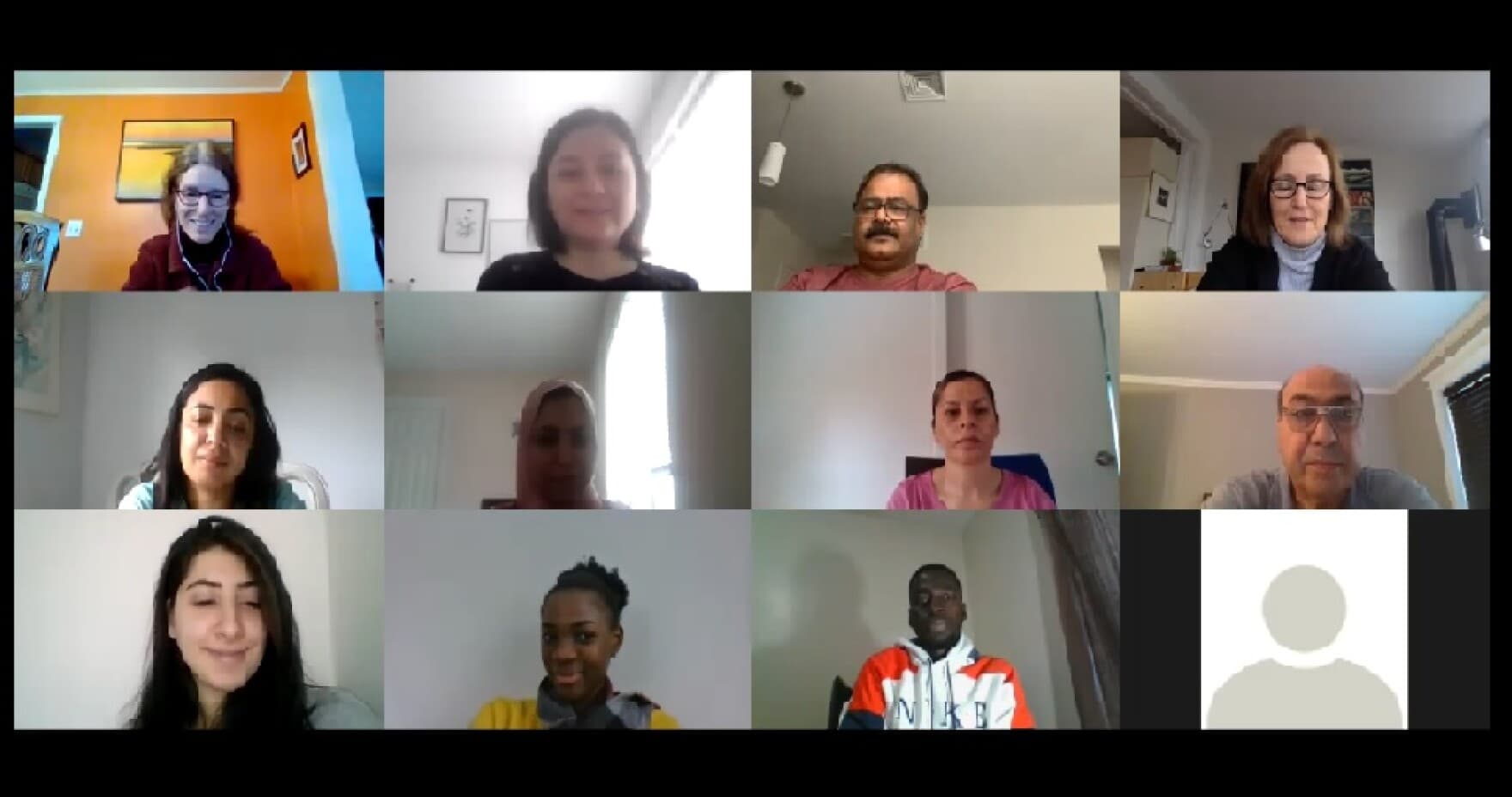 A zoom class with students at the International Institute of New England. They learn the language and U.S. history.