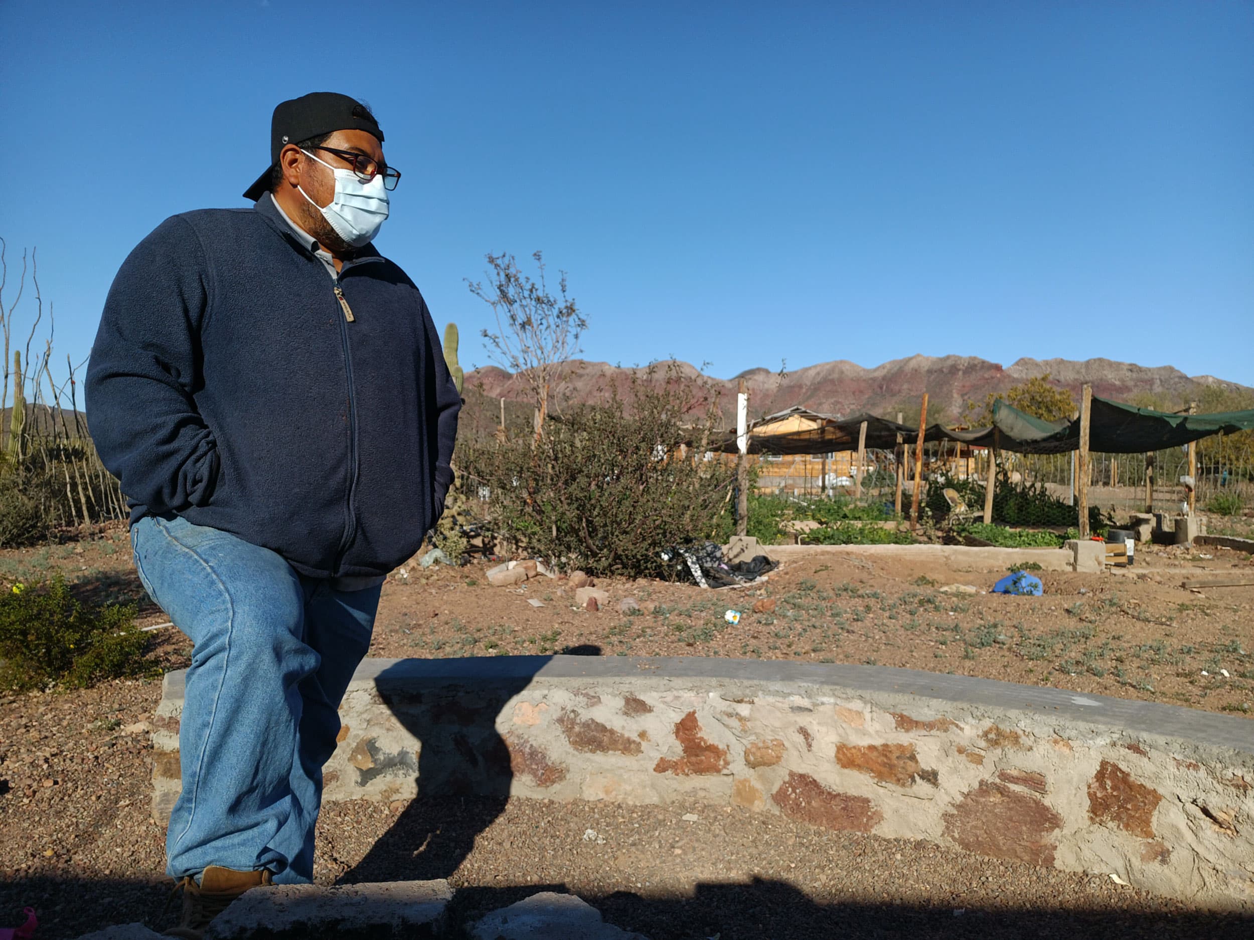 Mellado Moreno stands behind his home in Punta Chueca, northern Mexico.