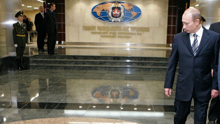 Russian President Vladimir Putin walks through a hall in the building housing Russia’s GRU military intelligence service. 