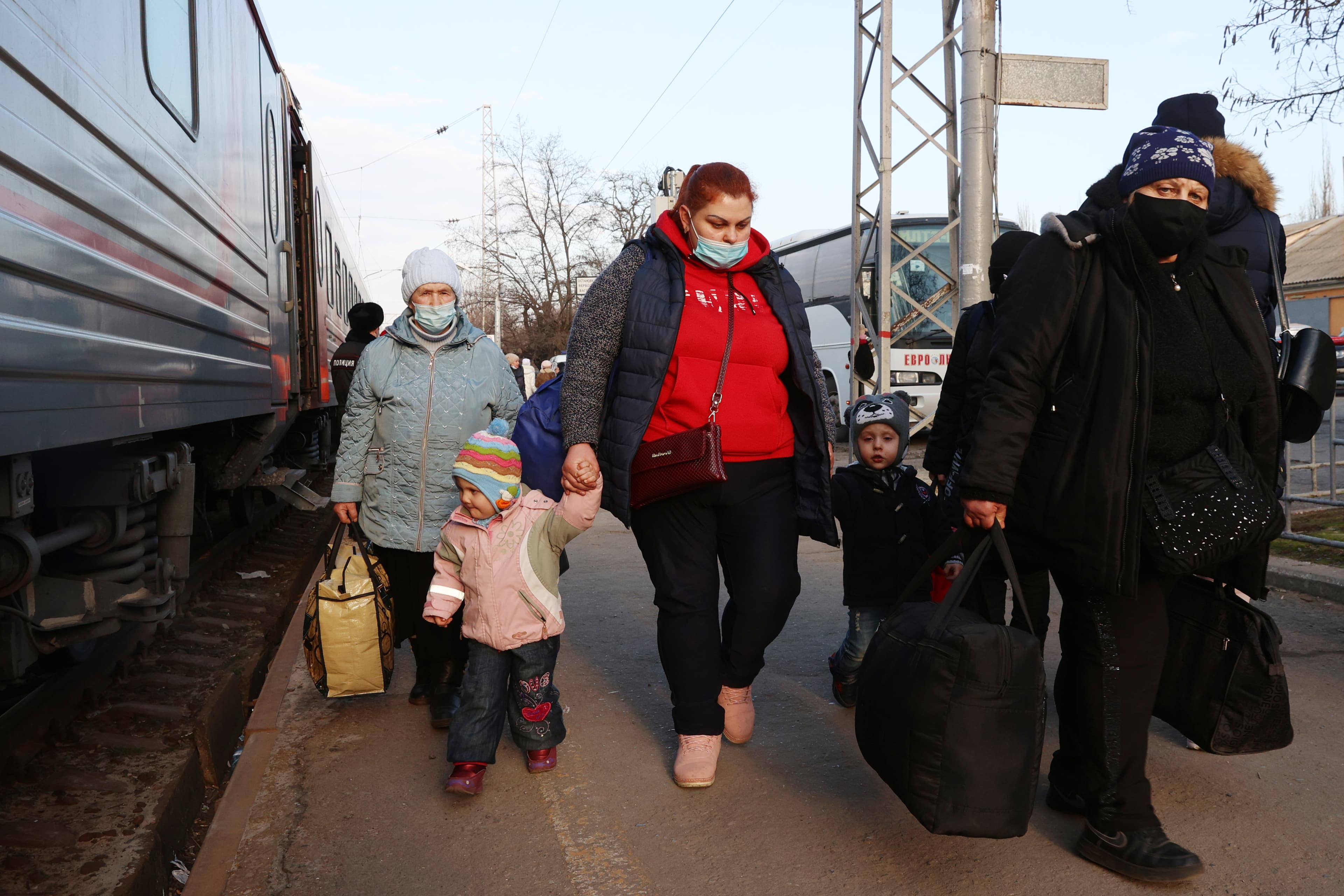 People evacuated from the Donbas region are seen on a train platform in Taganrog, Russia, on Feb. 18, 2022.