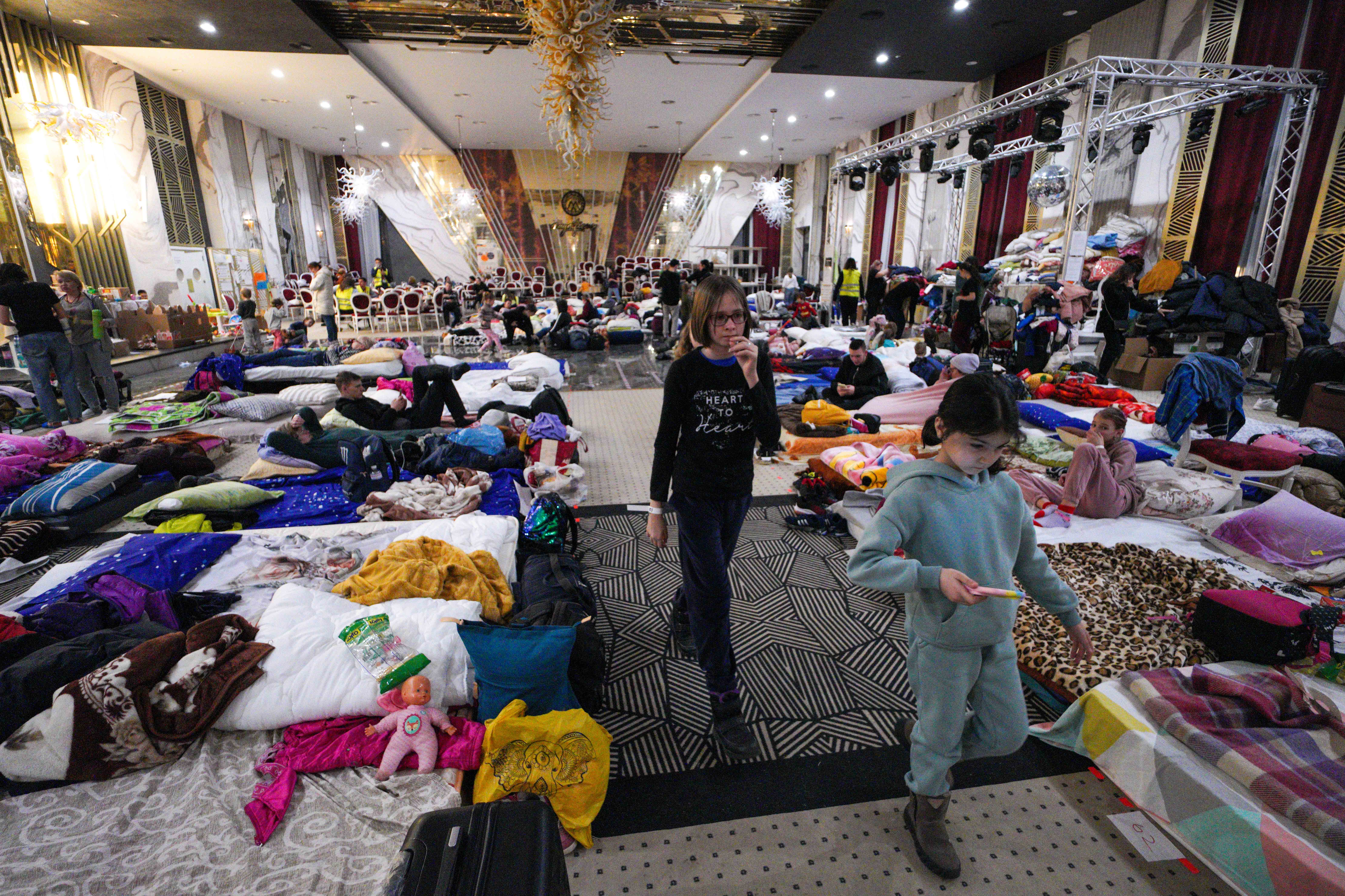 In the town of Suceava, Romania, the Mandachi Hotel and Spa, a four-star hotel converted its ballroom into a temporary shelter, serving food and other supplies to Ukrainian refugees.