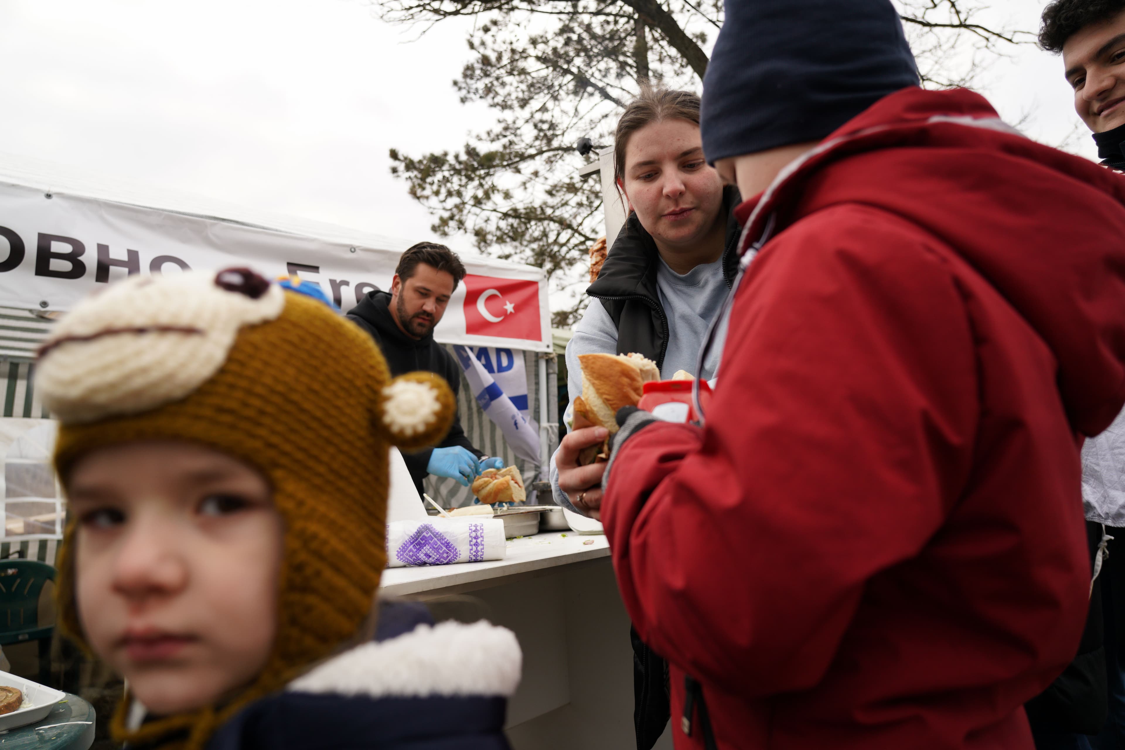 Volunteers hand out food and supplies to Ukrainian refugees at Siret customs at the border crossing point near the town of Suceava, in northern Romania.