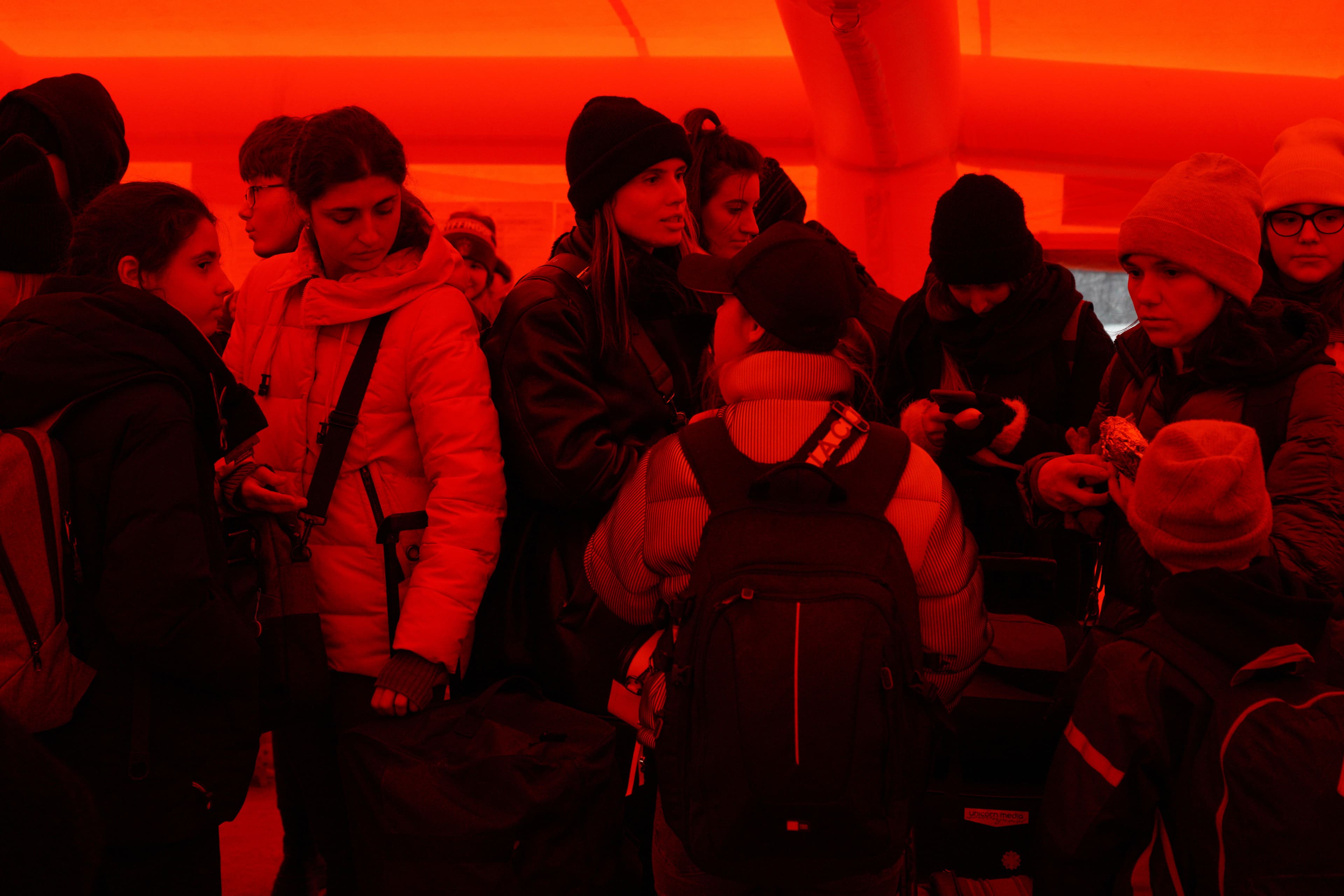 Unkrainian refugees wait in inflatable tents to keep warm before going through passport control at customs in Isaccea, on Romania’s southern border.