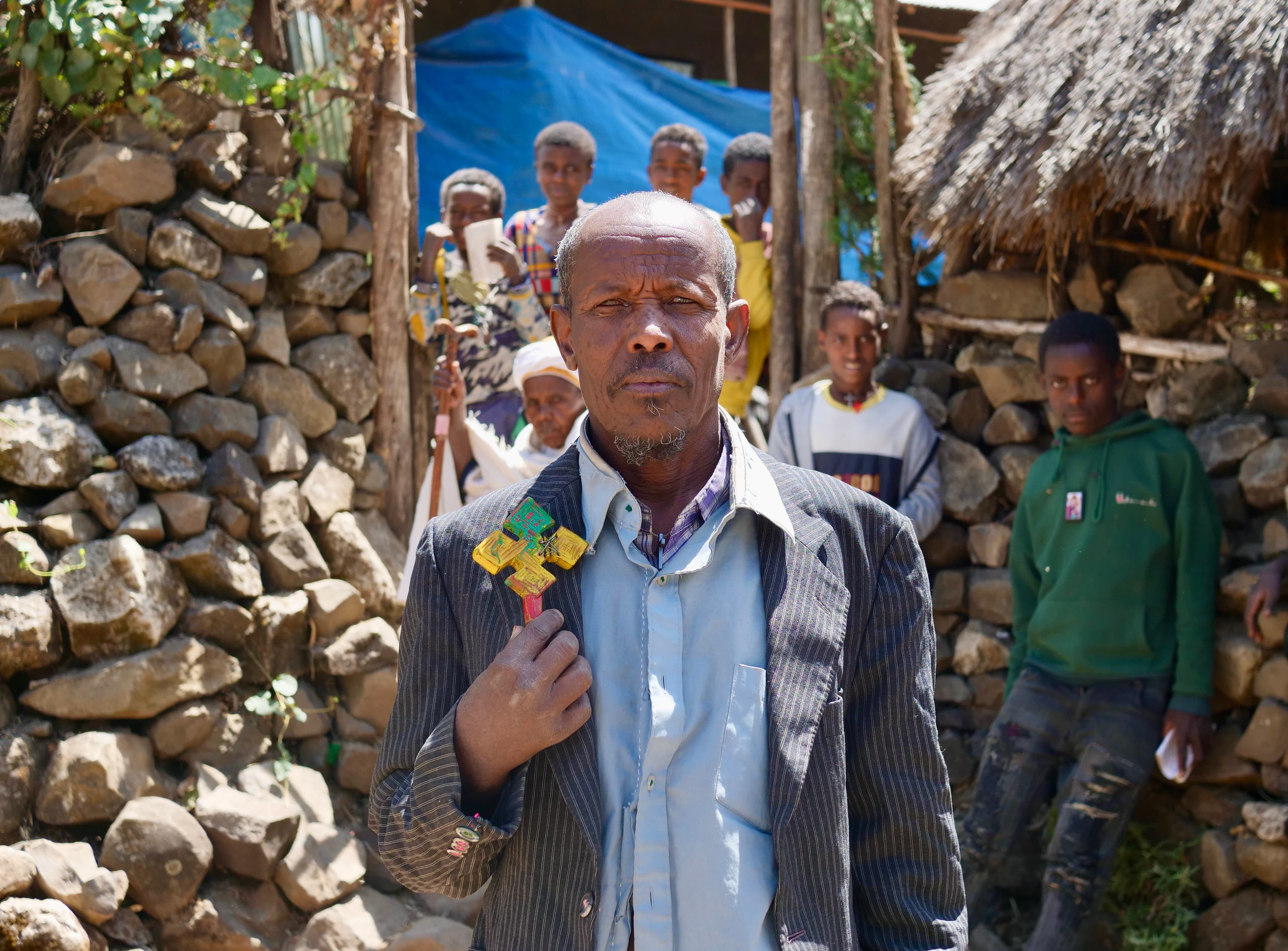 Priest Ayalew Setegn in front of the religious school, Amhara, Ethiopia, Feb.17, 2022